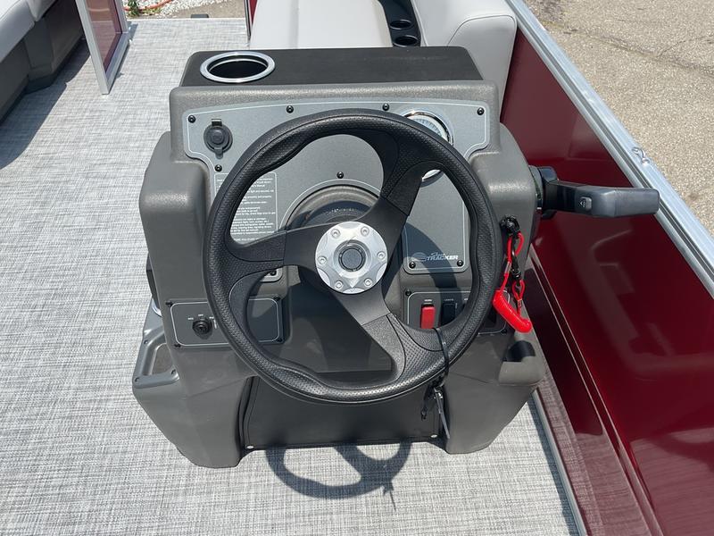 Steering console of 2026 Sun Tracker PB 16 DLX pontoon boat.