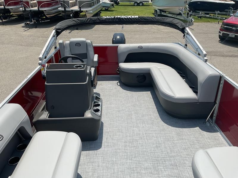 2026 Sun Tracker PB 16 DLX pontoon boat interior with gray seating and red accents.