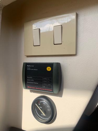 Control panel and switches inside a 2004 Mainship Pilot 30-II Sedan boat.