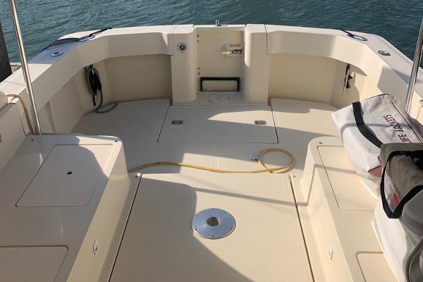 2004 Mainship Pilot 30-II Sedan boat deck with seating and storage compartments.