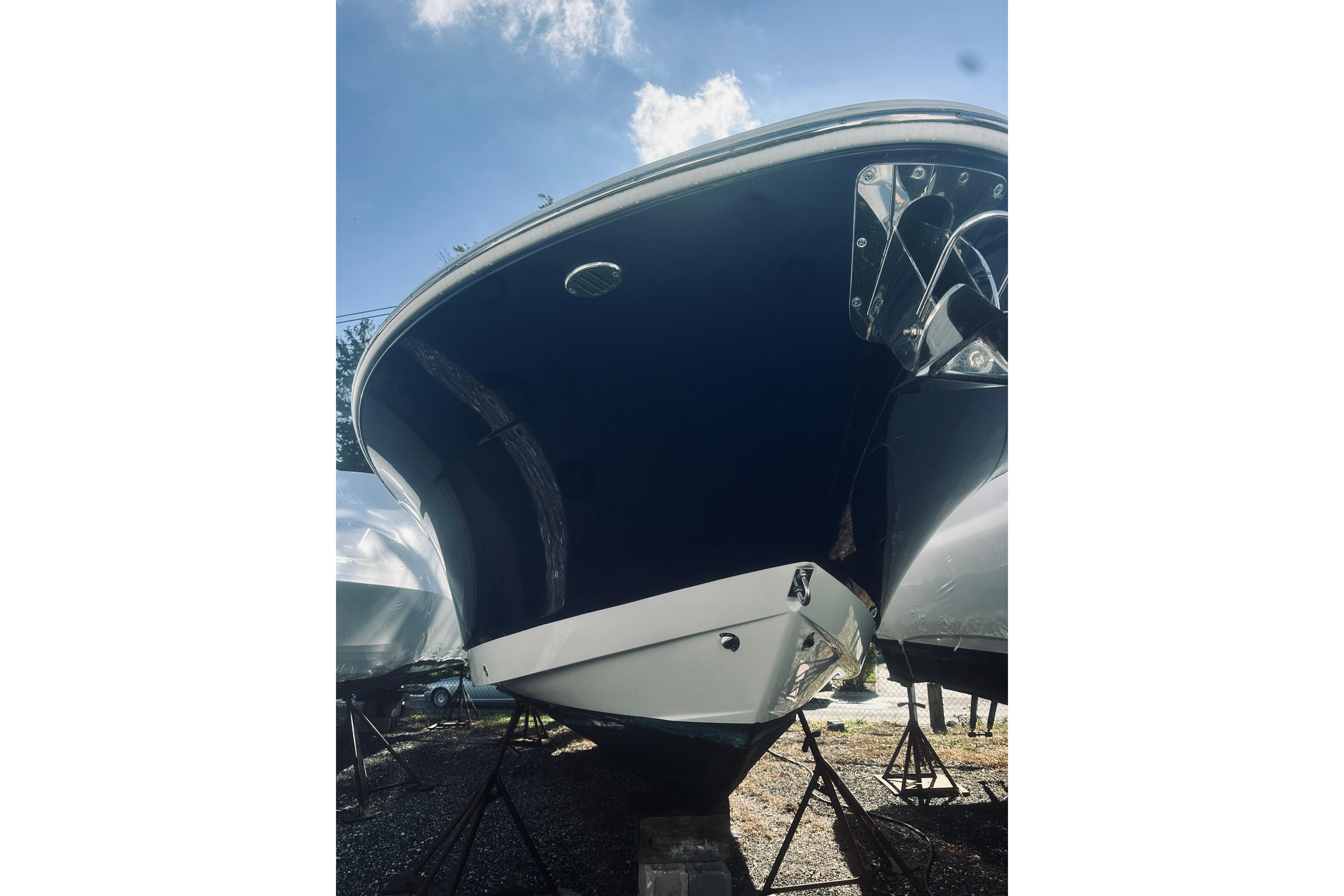2022 Robalo R272 Center Console boat on stands, viewed from the front.
