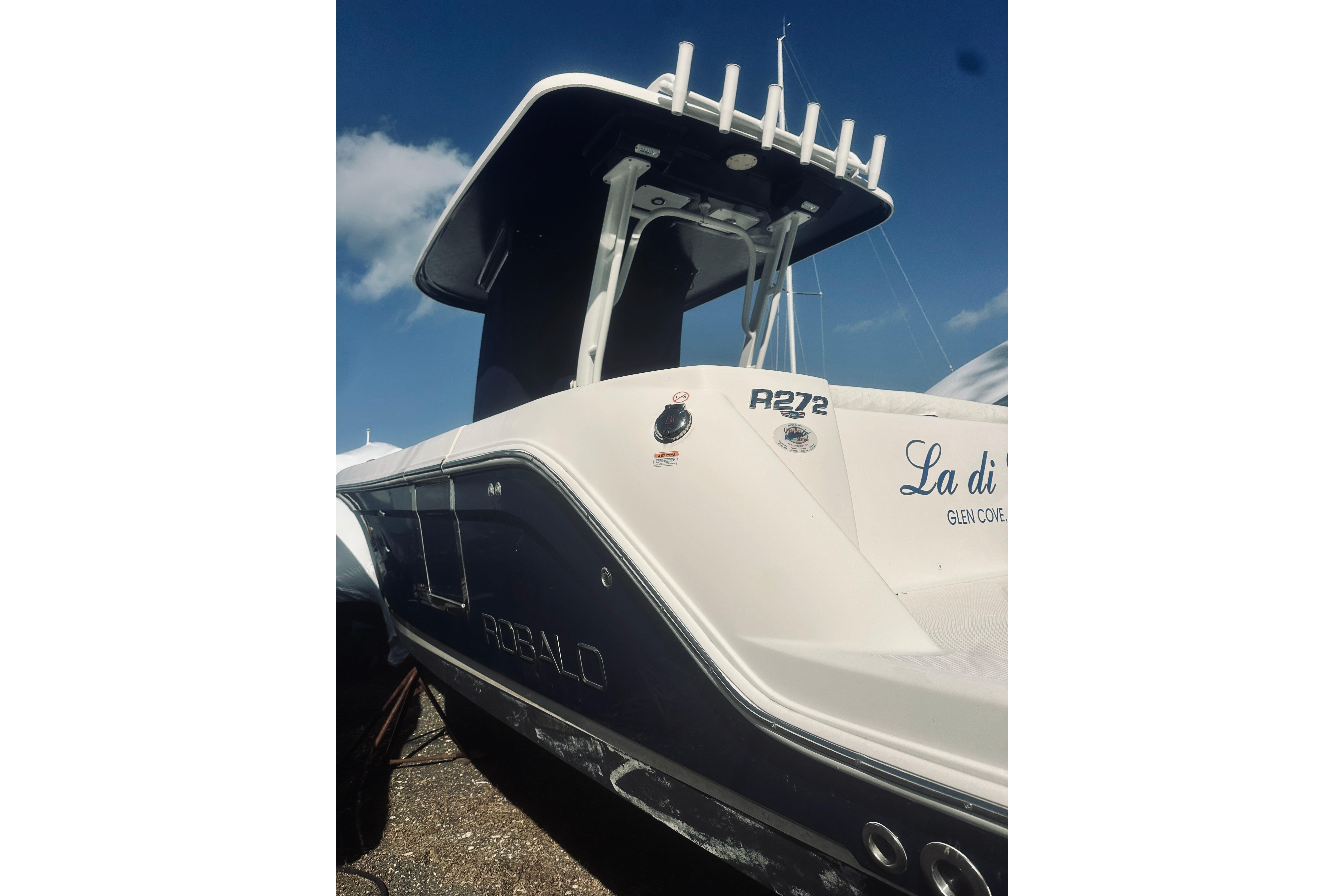 2022 Robalo R272 Center Console boat with sleek design under blue sky.