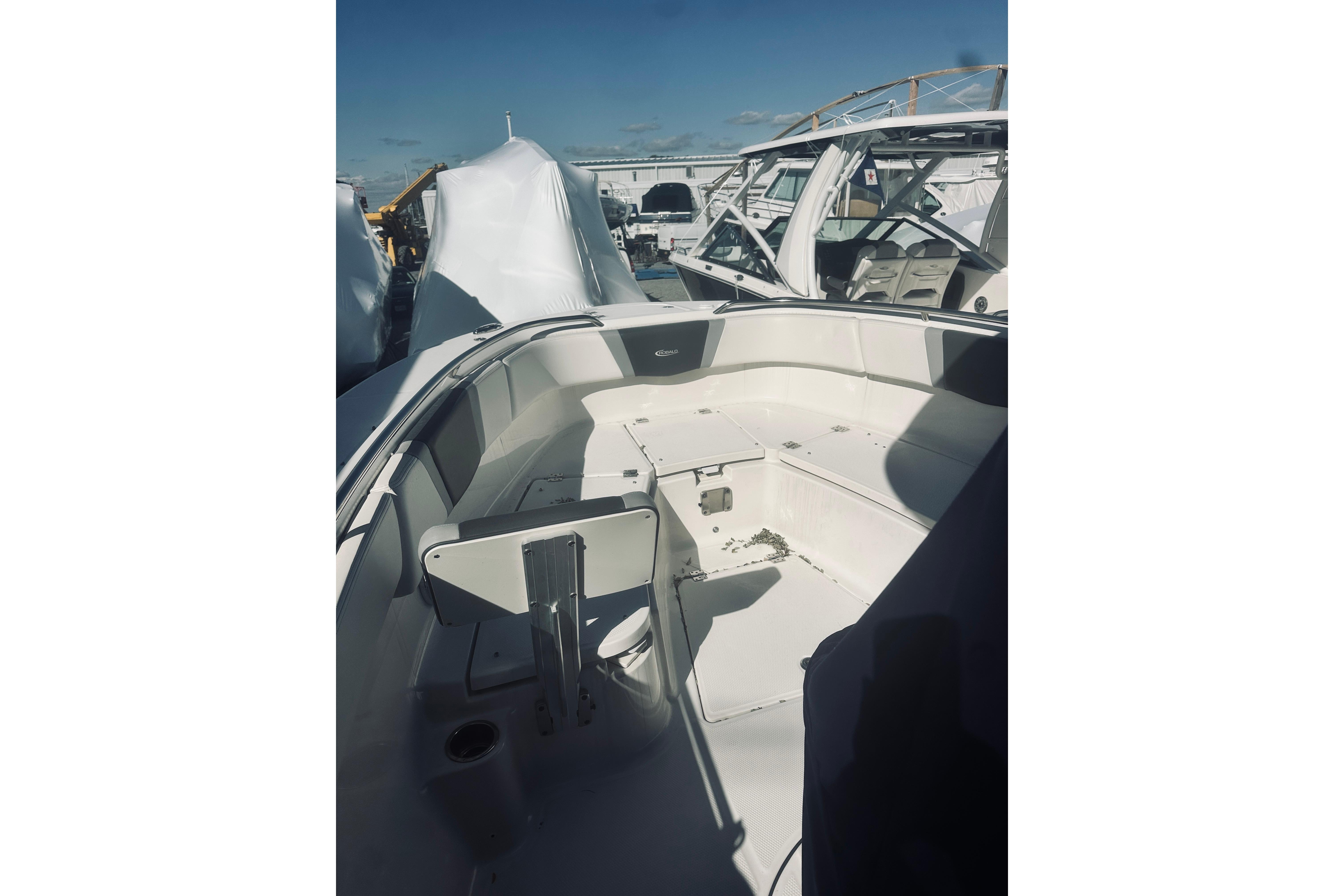 2022 Robalo R272 Center Console boat interior with seating and storage.