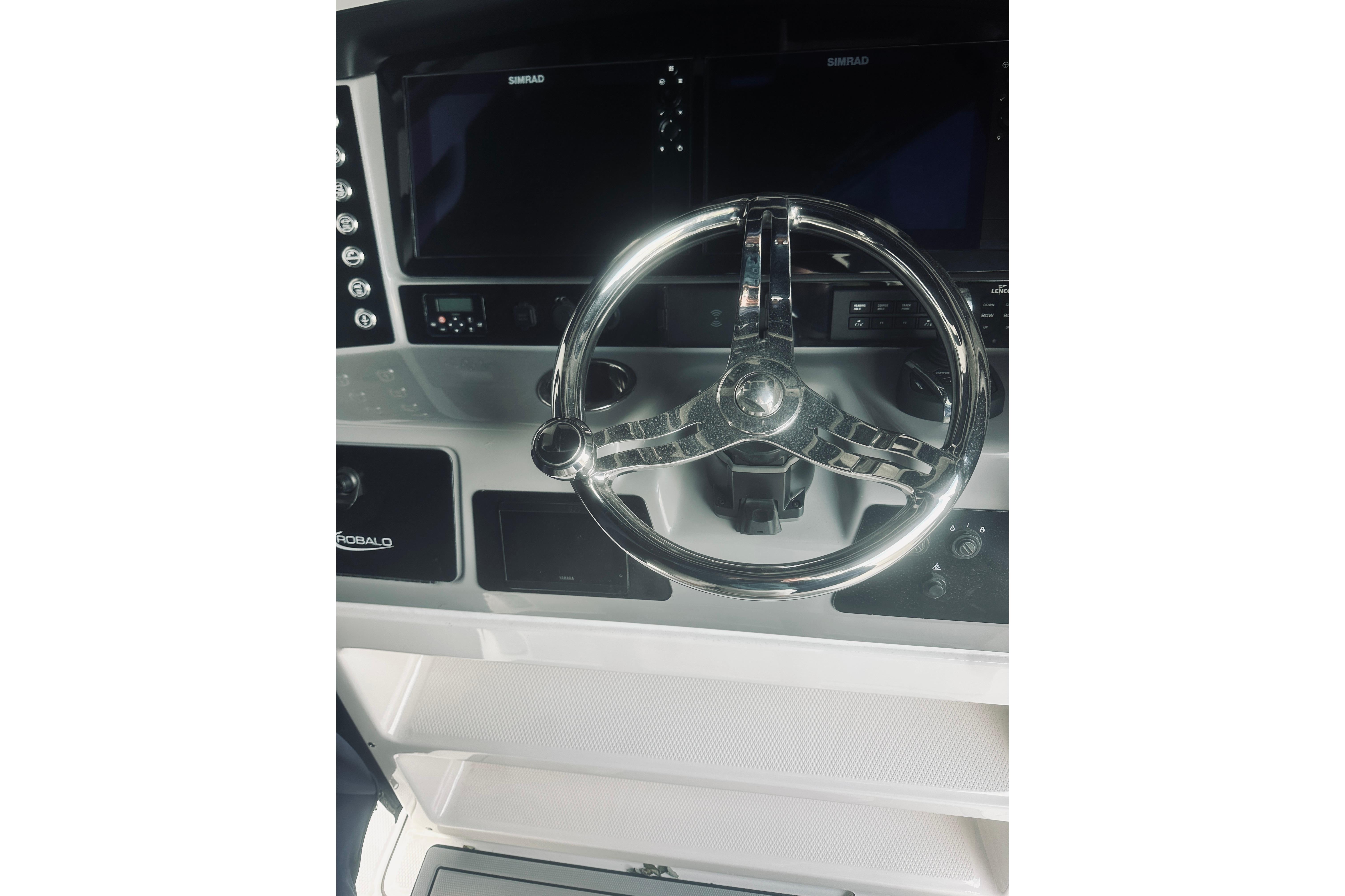2022 Robalo R272 Center Console steering wheel and dashboard controls.