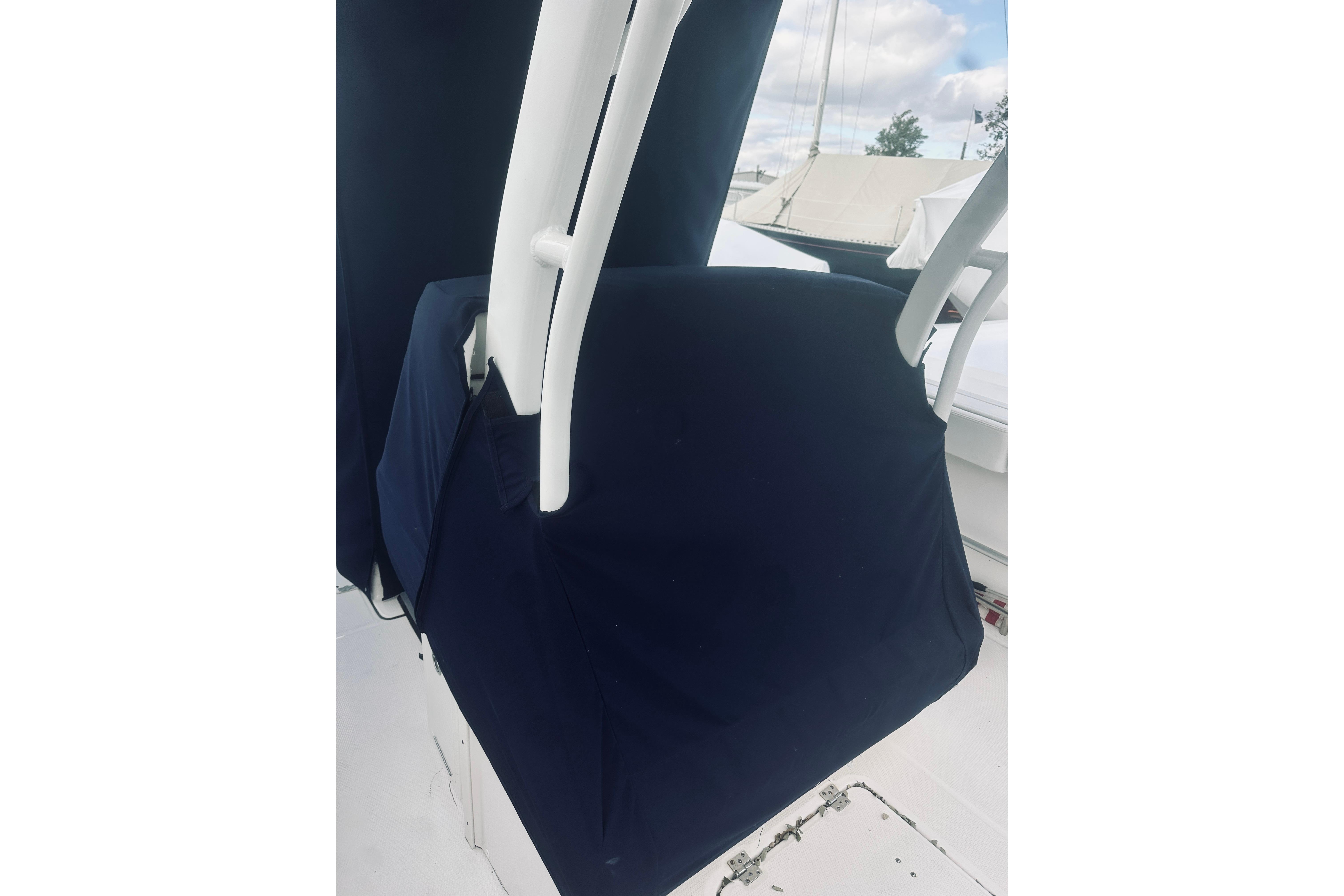 2022 Robalo R272 Center Console boat with protective cover, showcasing sleek design.