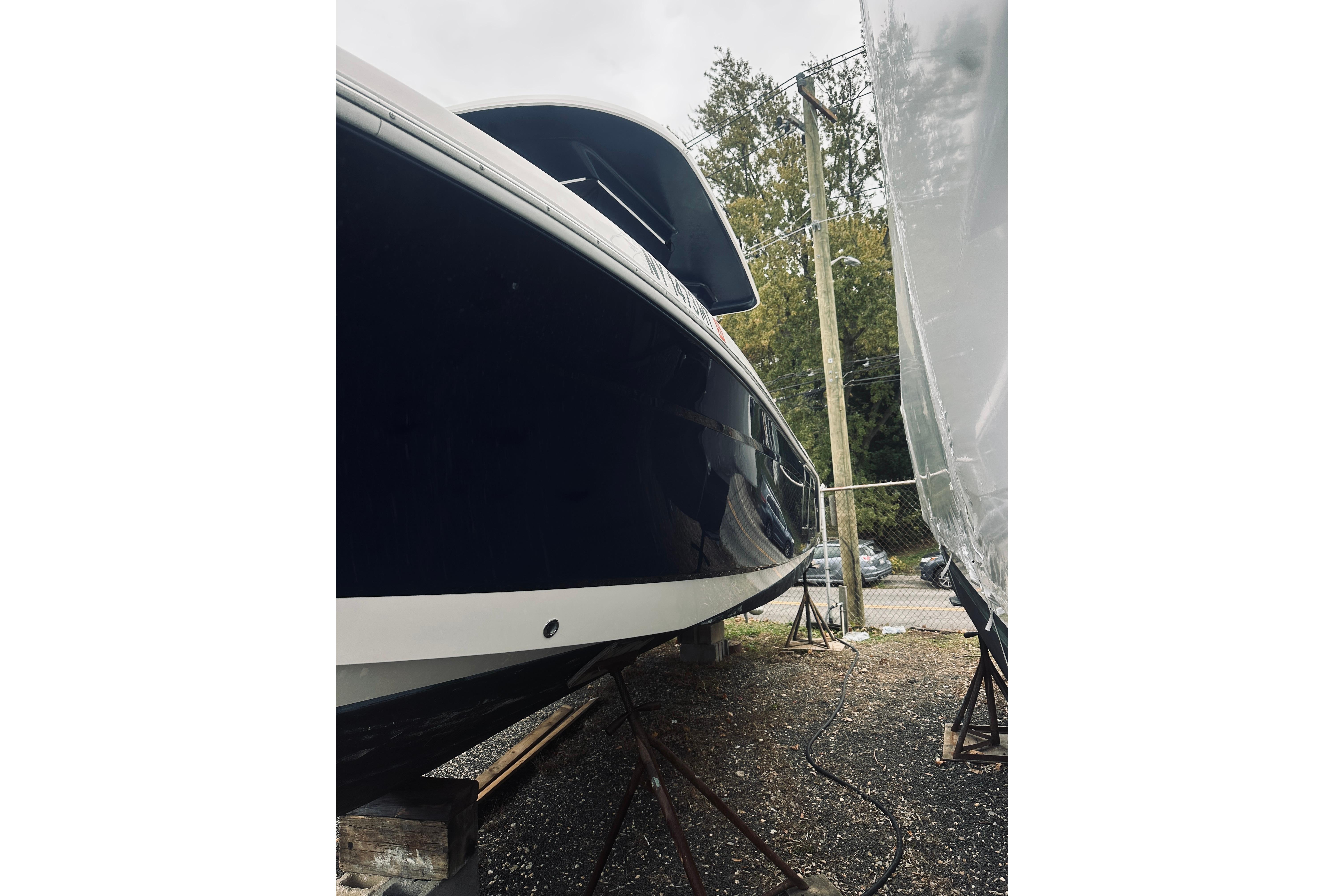 2022 Robalo R272 Center Console boat on stands, side view.