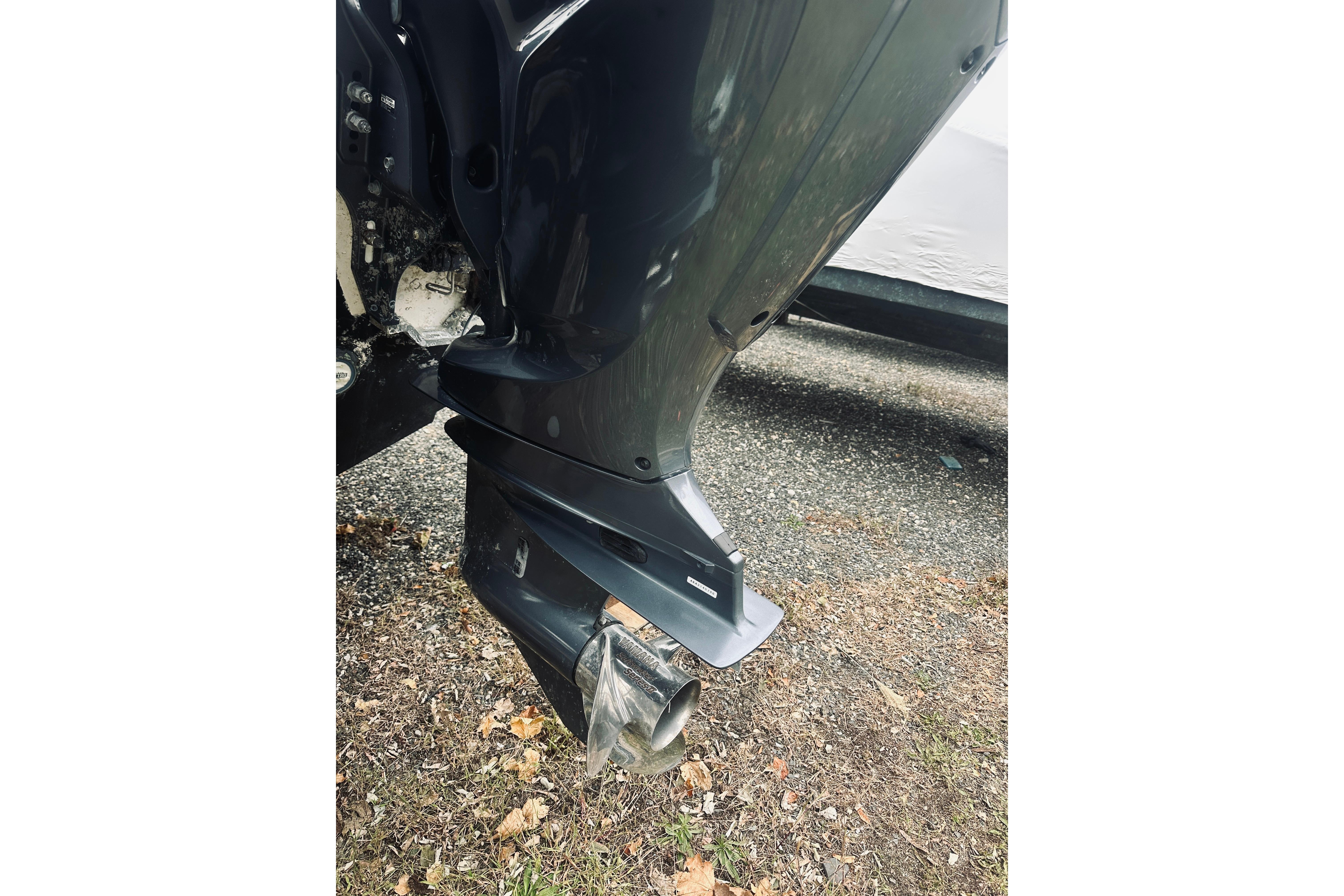 2022 Robalo R272 Center Console boat engine close-up on gravel.