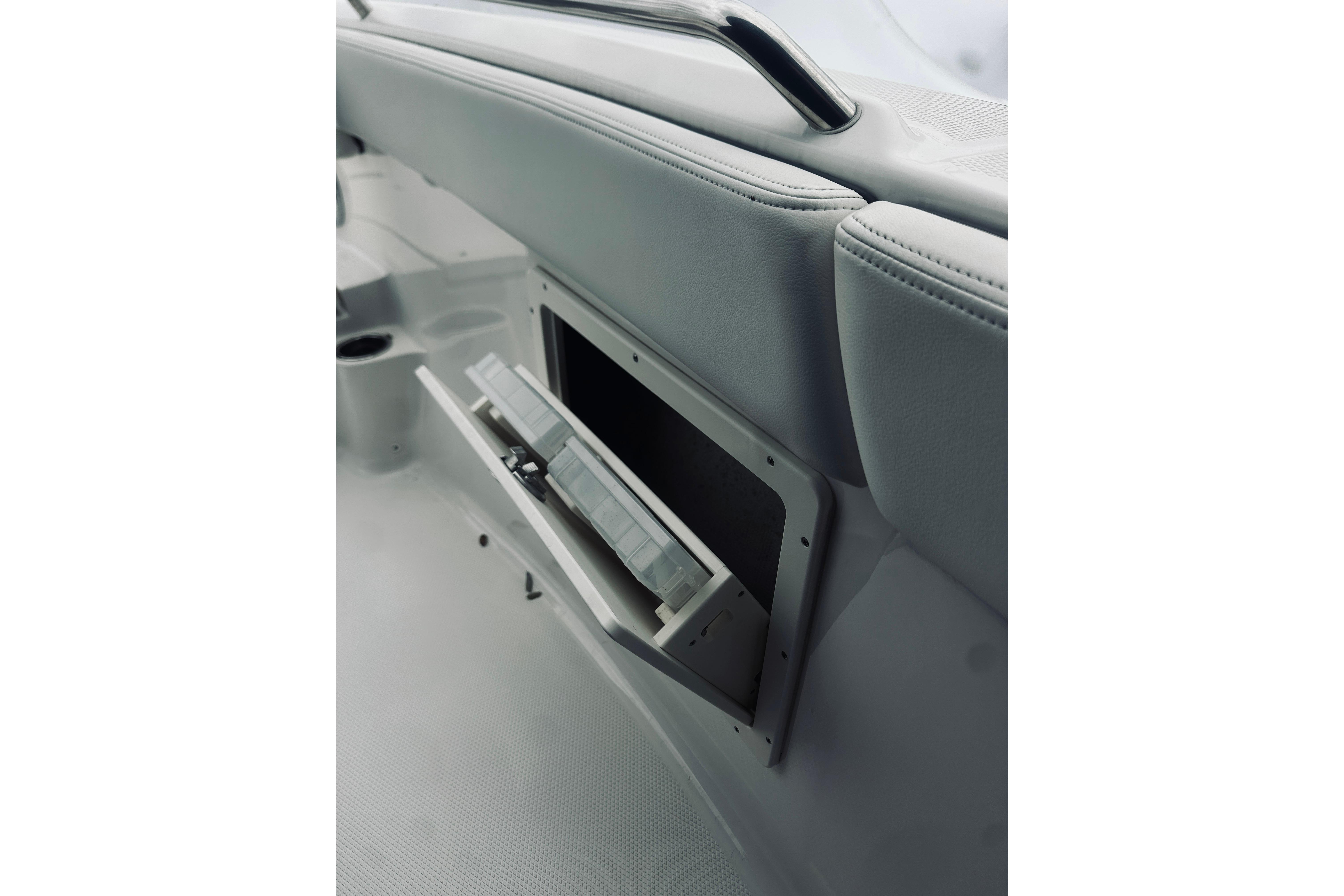 2022 Robalo R272 Center Console boat storage compartment with open lid.