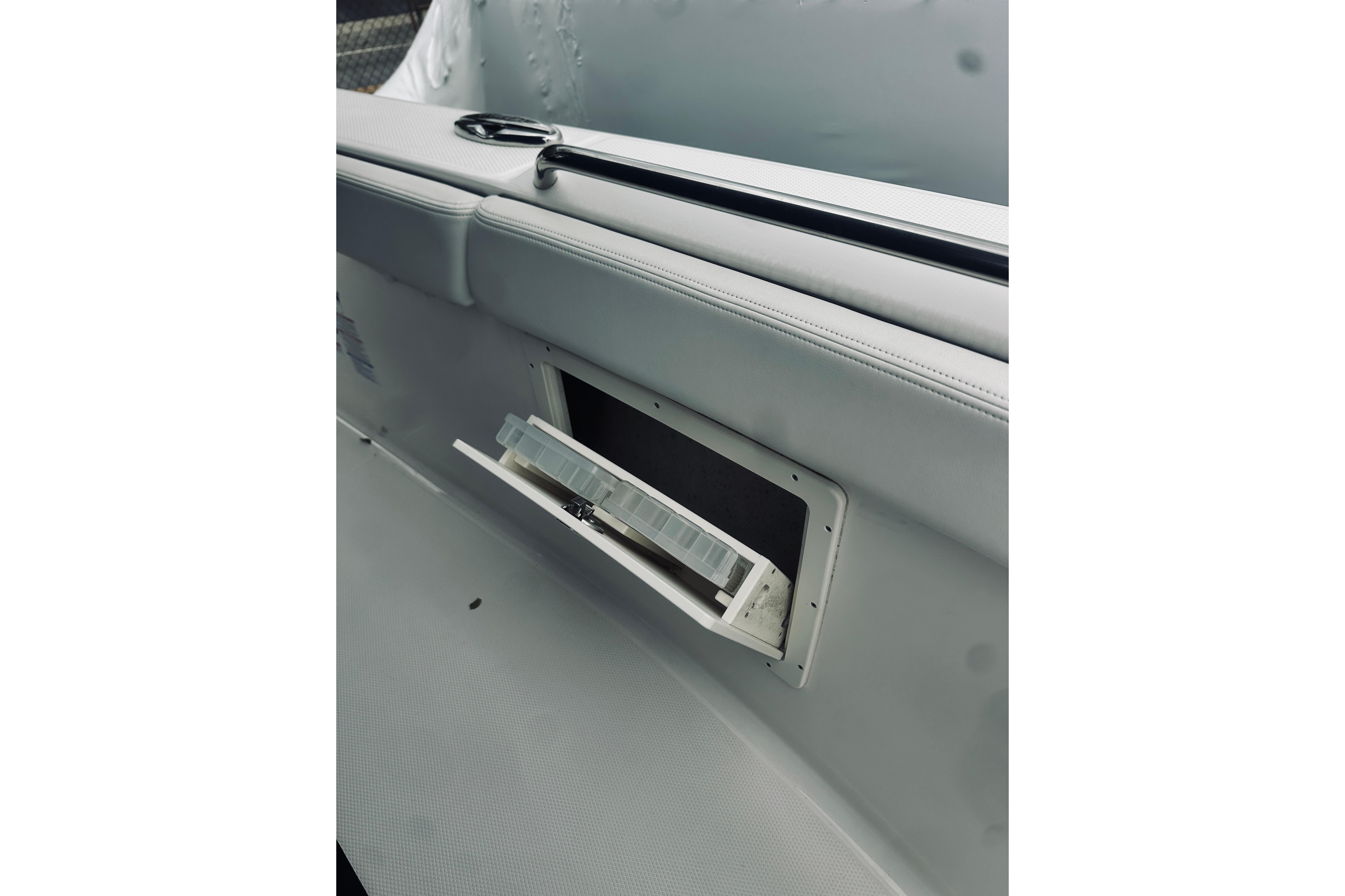 2022 Robalo R272 Center Console boat interior with open storage compartment.