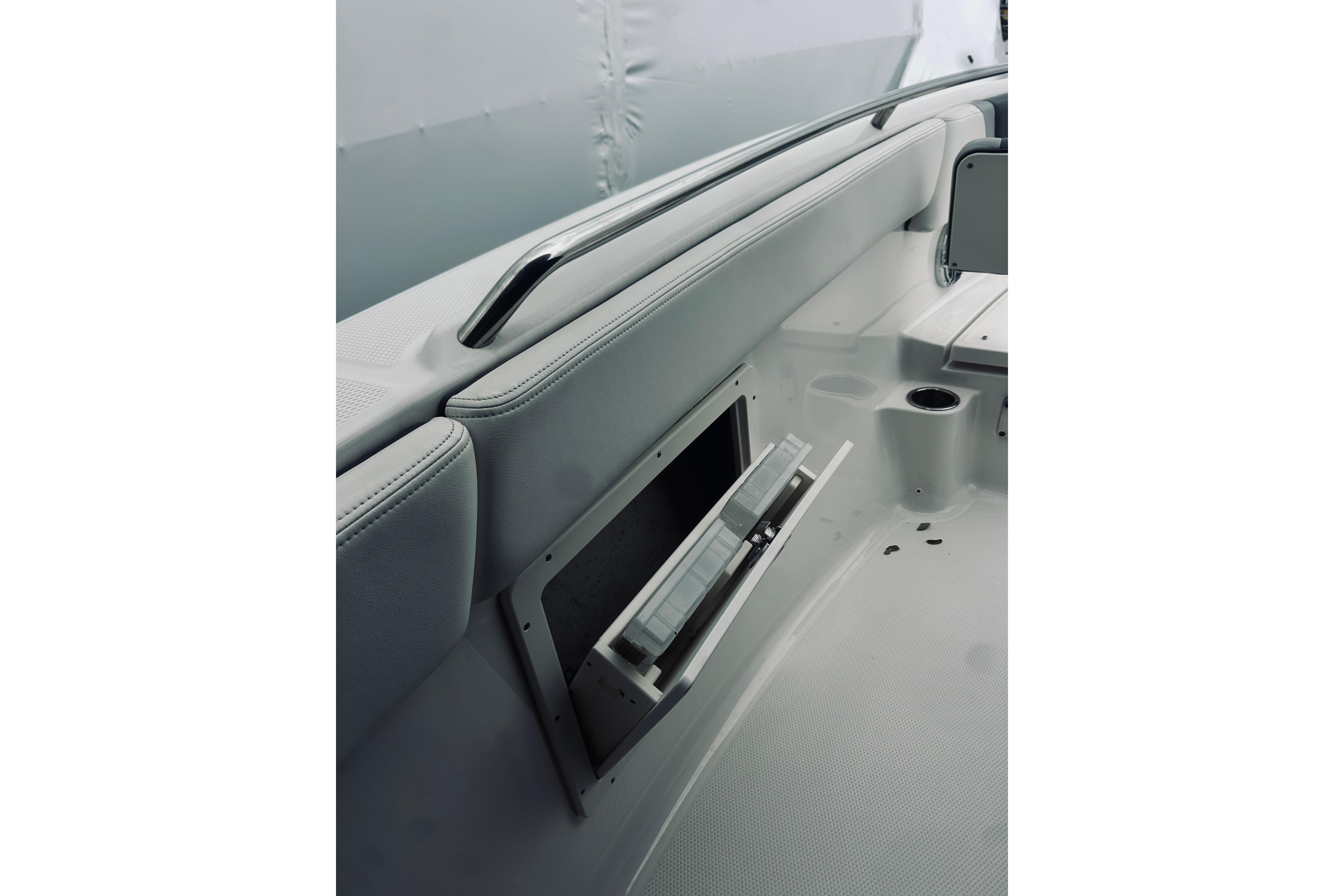 2022 Robalo R272 Center Console interior with storage compartment and seating.
