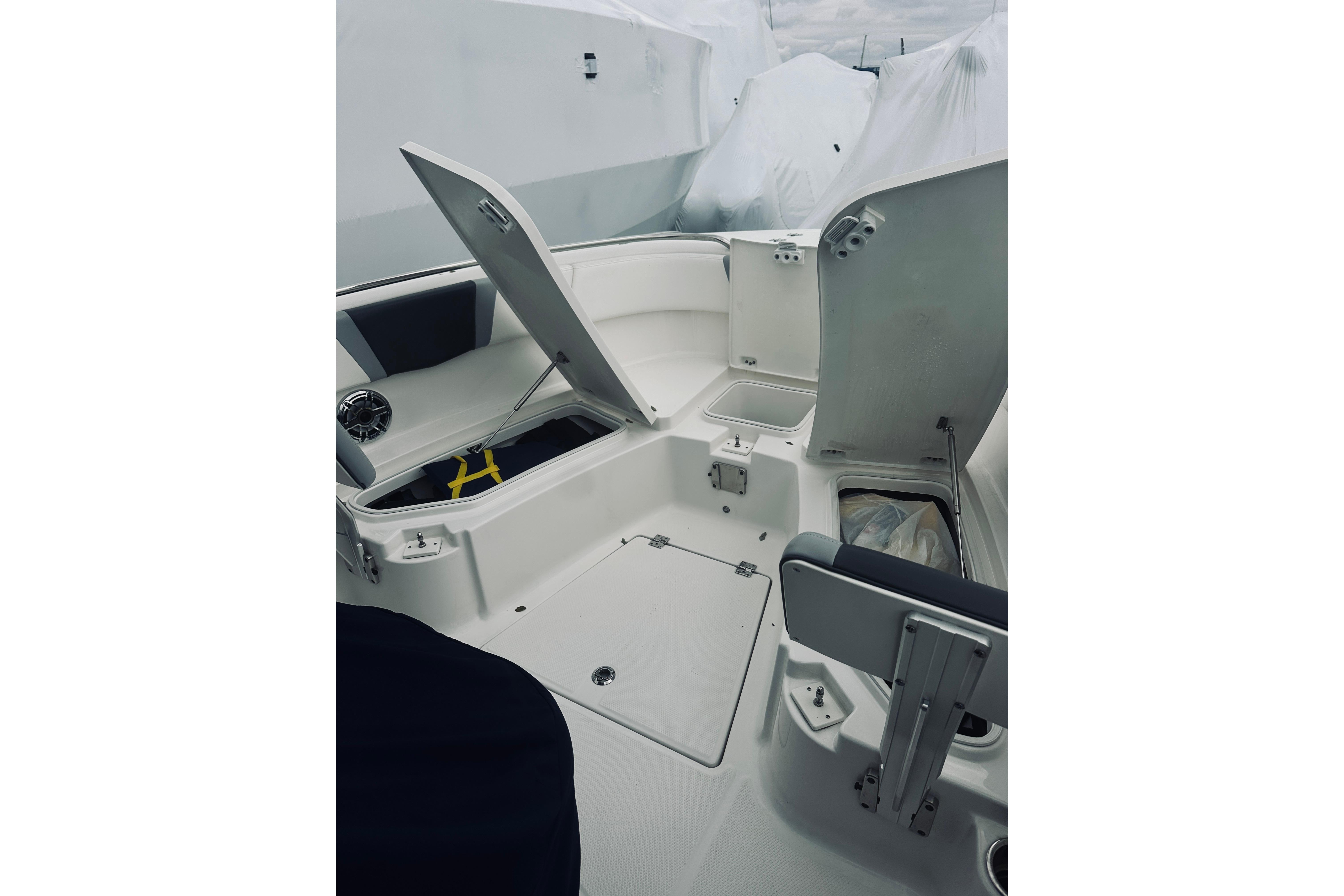 2022 Robalo R272 Center Console boat interior with open storage compartments.
