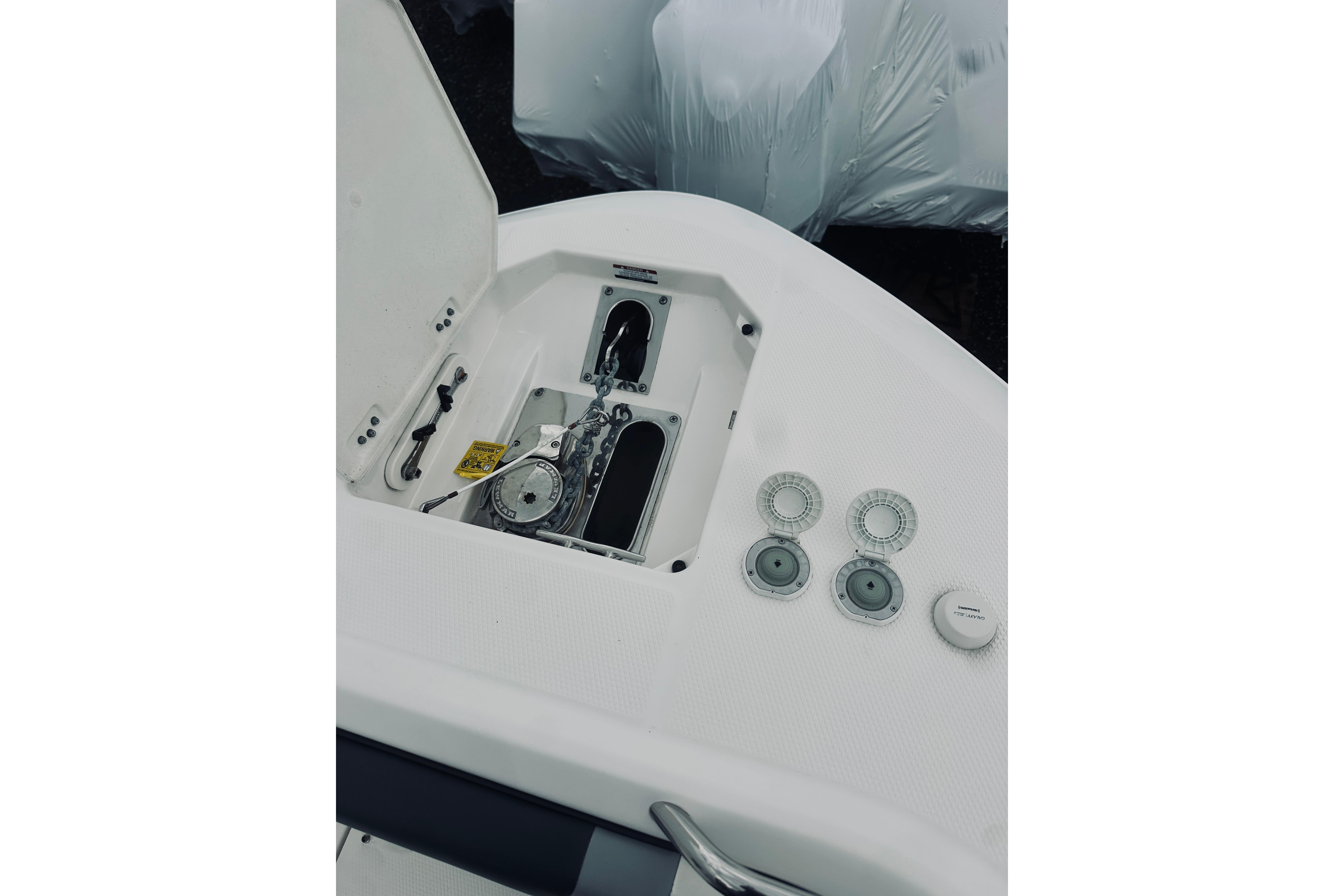 2022 Robalo R272 Center Console boat anchor compartment and controls.