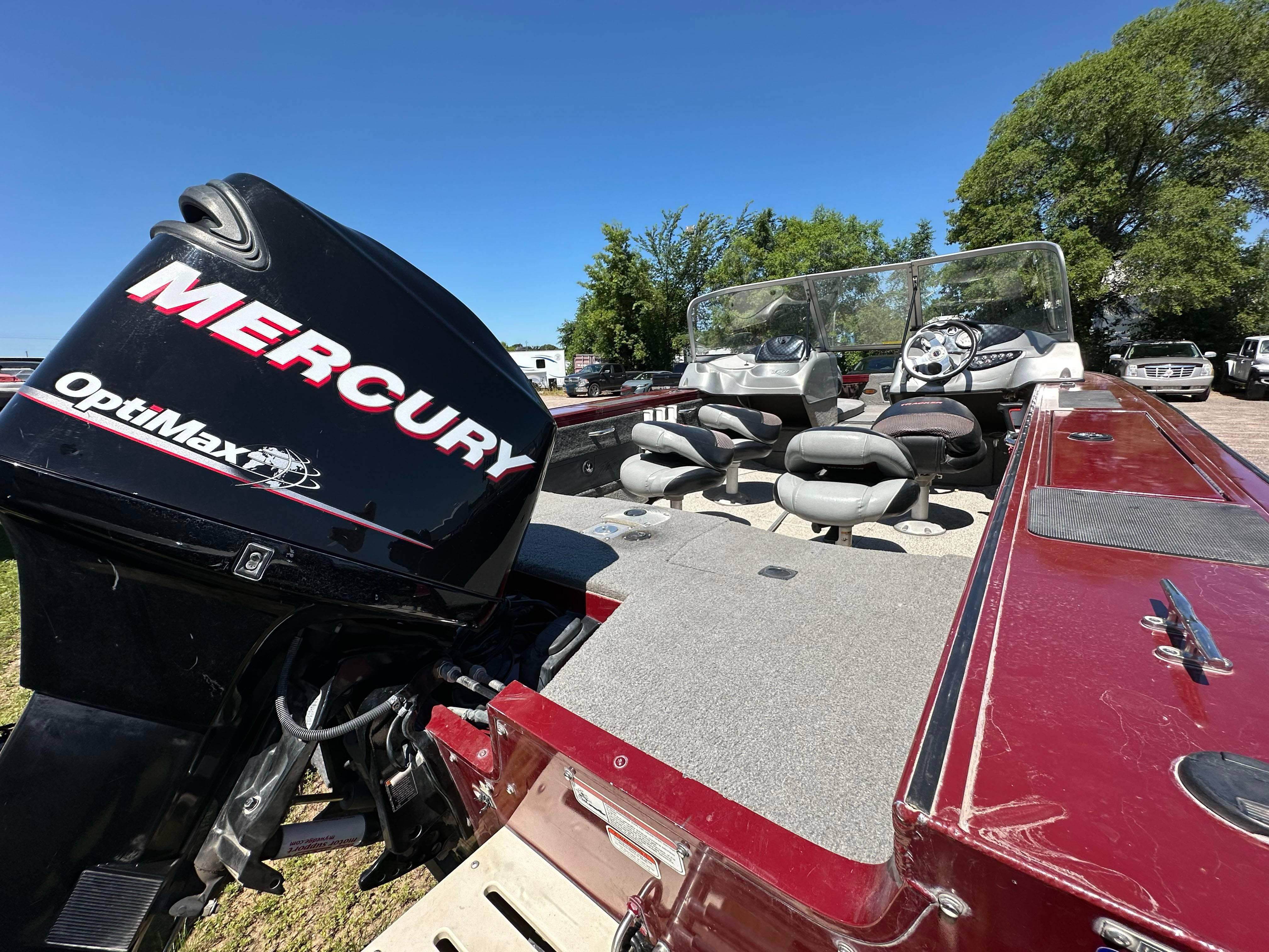 2011 Tracker Targa V-18 Combo boat with Mercury OptiMax engine, parked outdoors.
