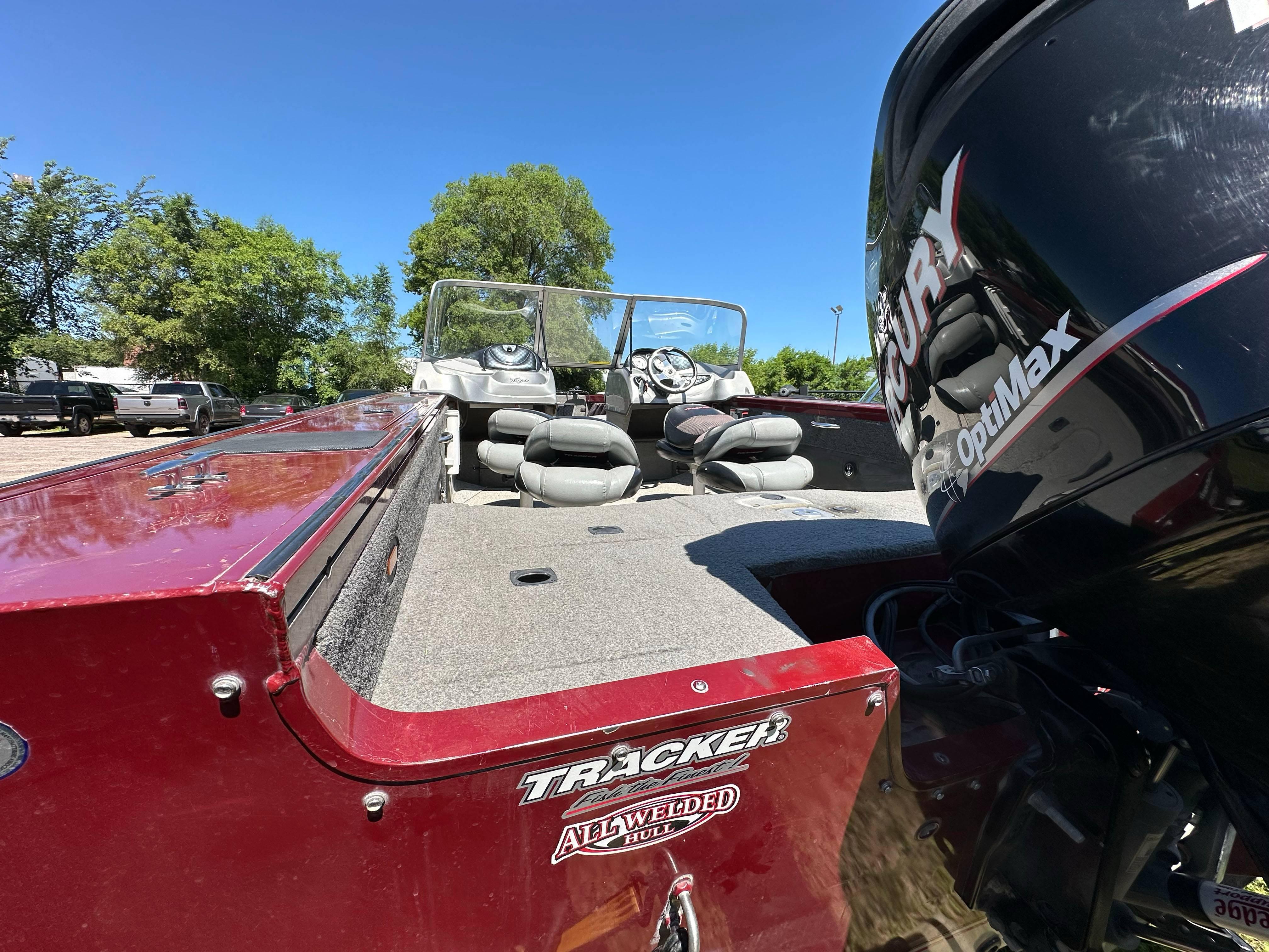 2011 Tracker Targa V-18 Combo boat with Mercury OptiMax engine, parked outdoors.