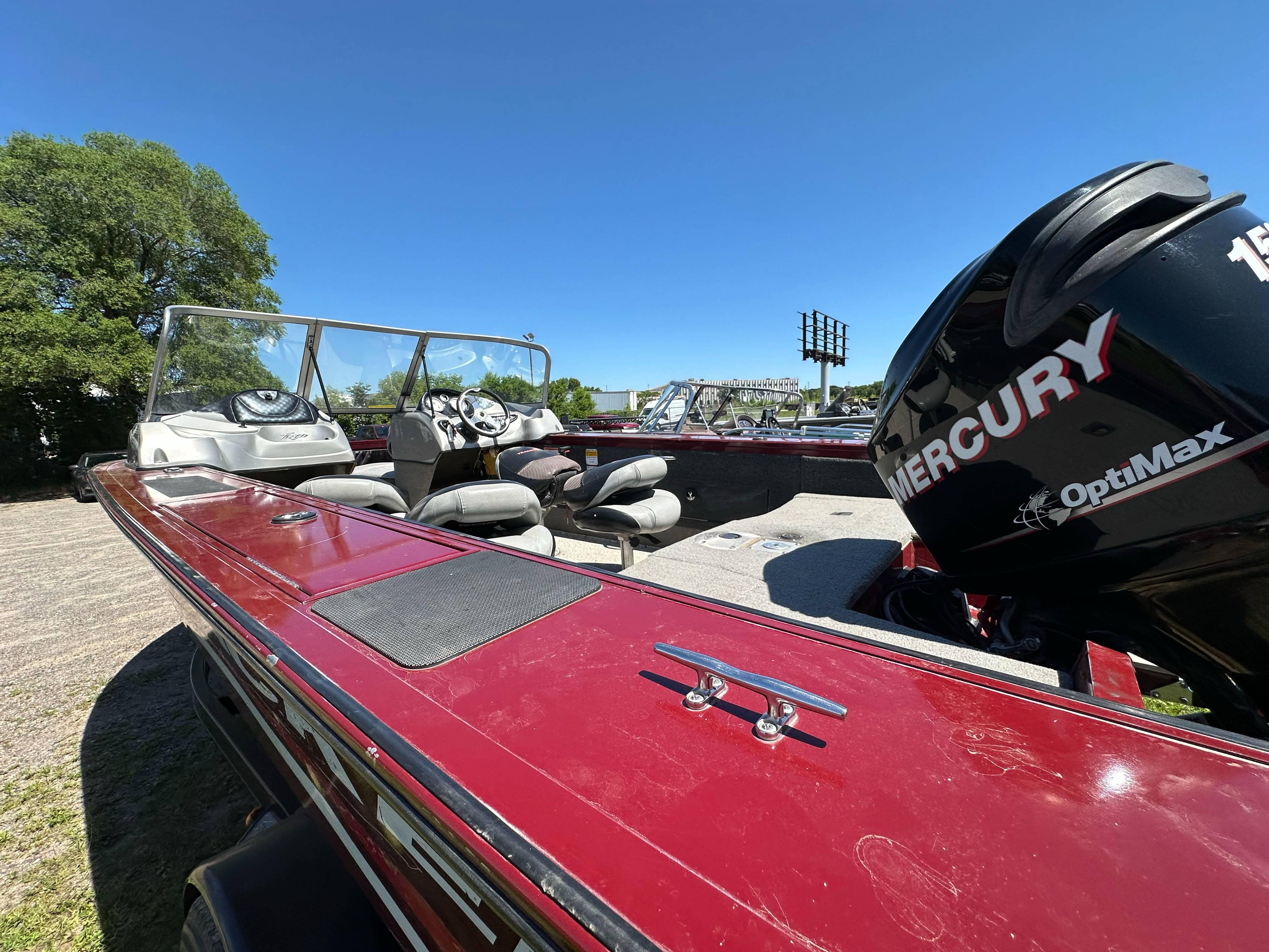 2011 Tracker Targa V-18 Combo boat with Mercury OptiMax engine, parked outdoors.