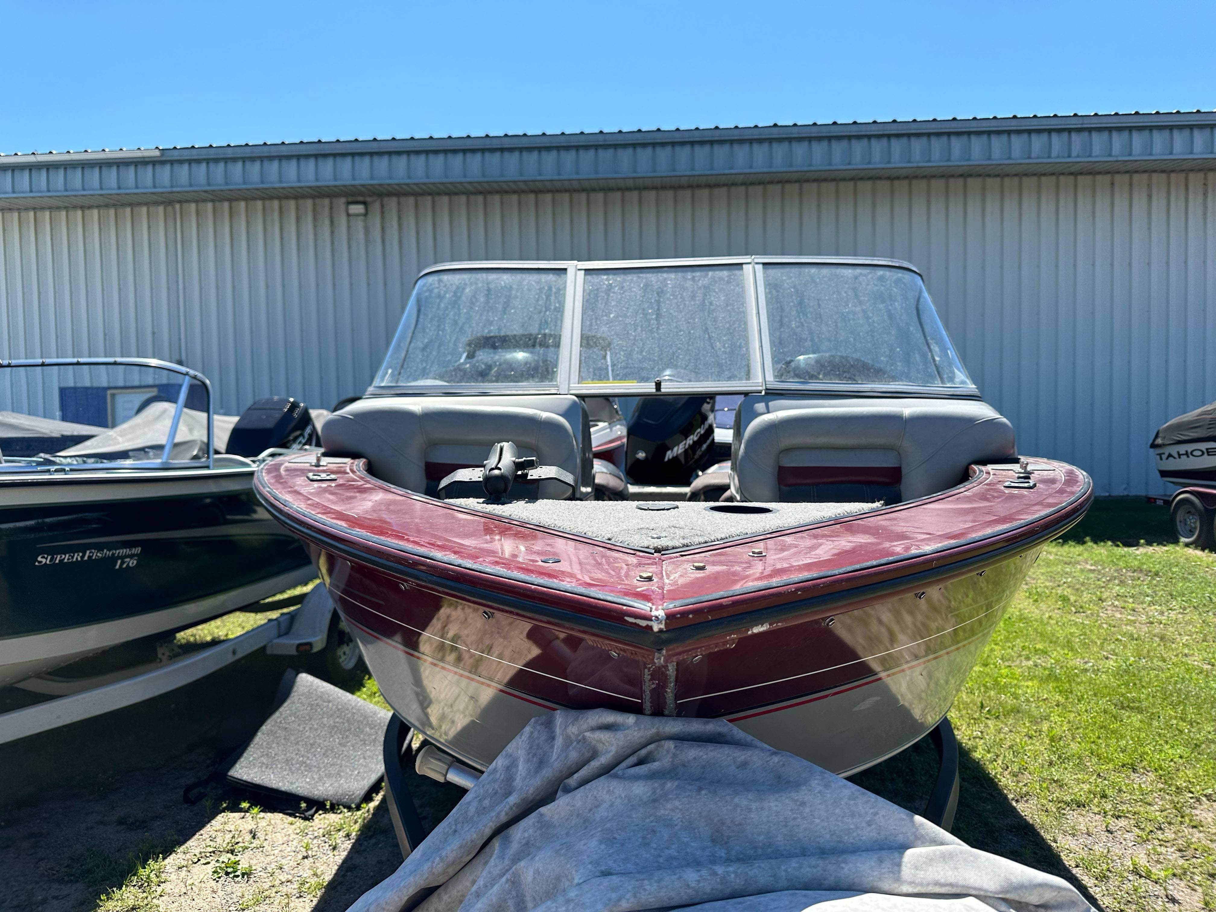 2011 Tracker Targa V-18 Combo boat parked outdoors, front view.