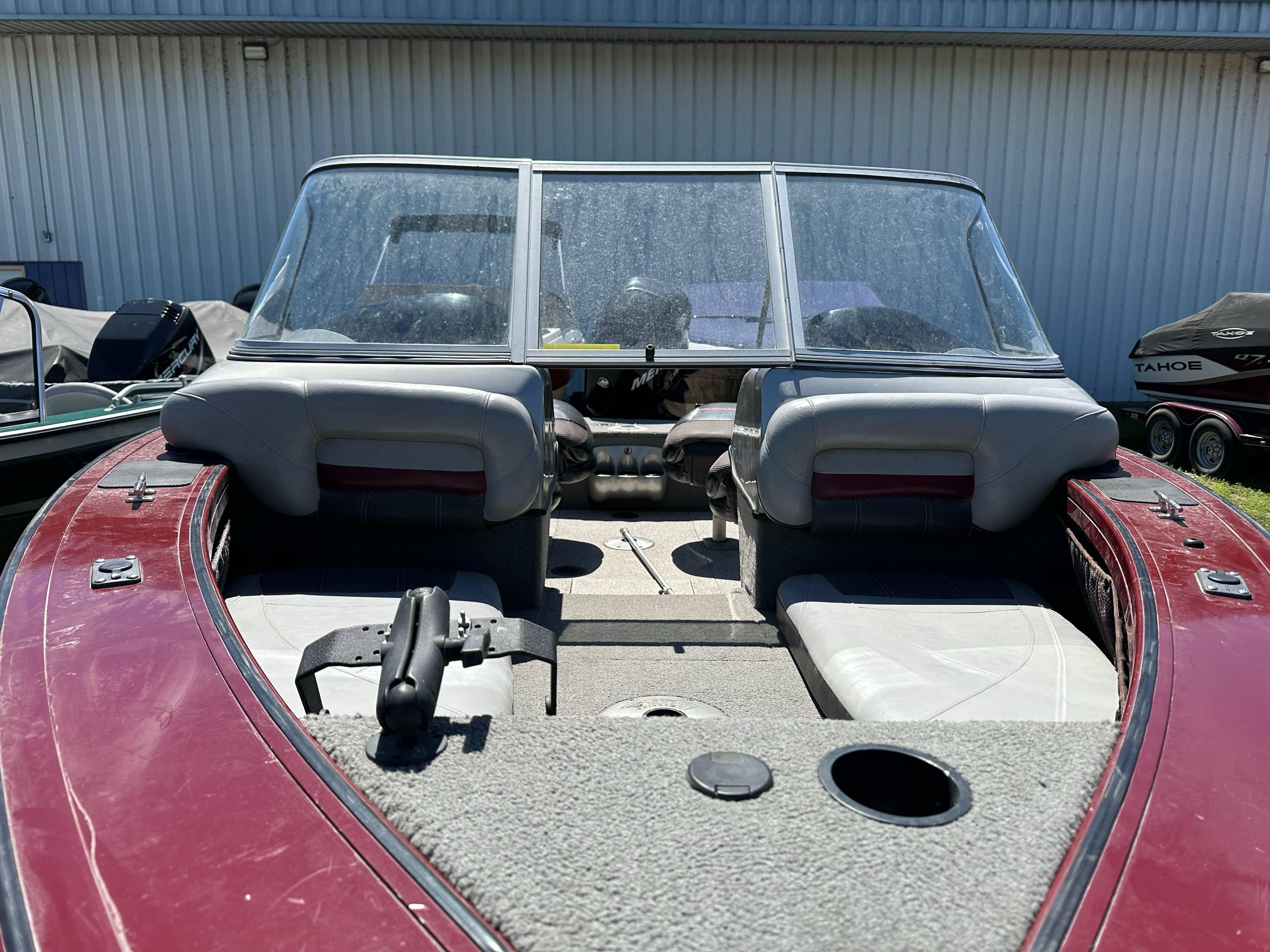 2011 Tracker Targa V-18 Combo boat interior with red and gray seating.