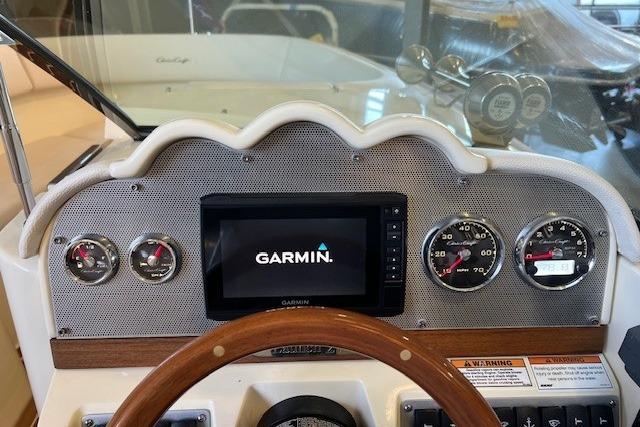 2021 Chris-Craft Launch 27 dashboard with Garmin display and classic gauges.