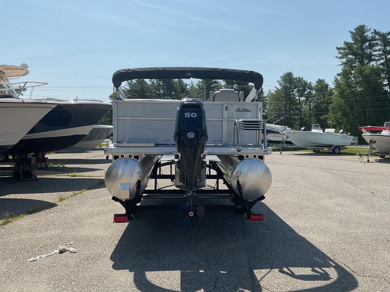 2026 Sun Tracker PB 16 DLX pontoon boat with 50 HP motor in a marina.