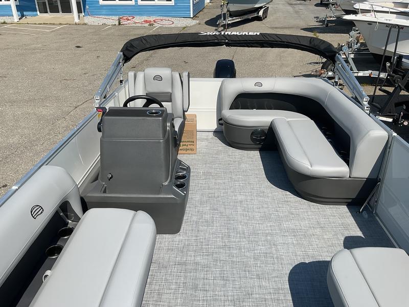 2026 Sun Tracker PB 16 DLX pontoon boat interior with gray seating and steering console.