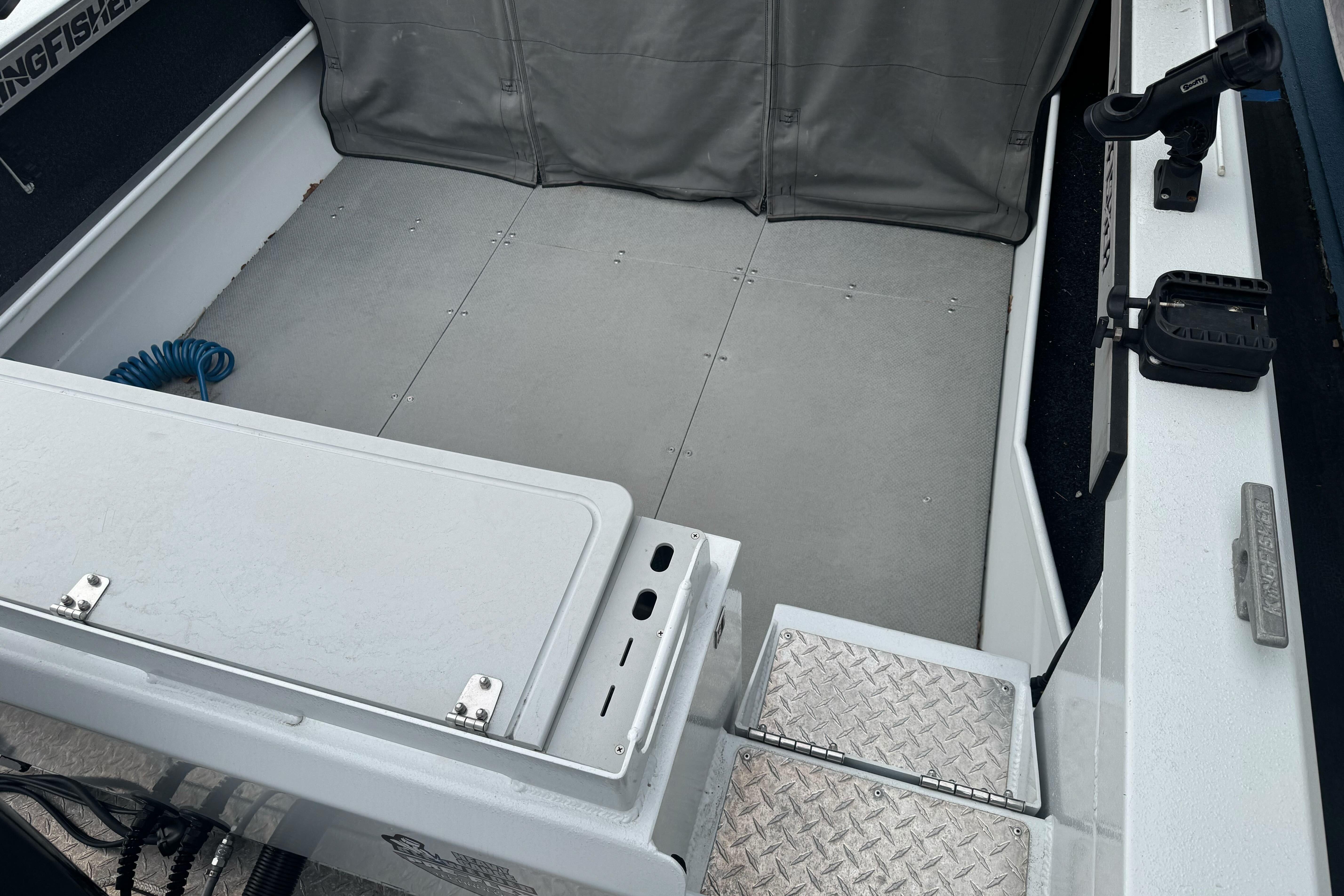 Interior view of a 2021 KingFisher 2025 Escape HHT boat, featuring a spacious deck.