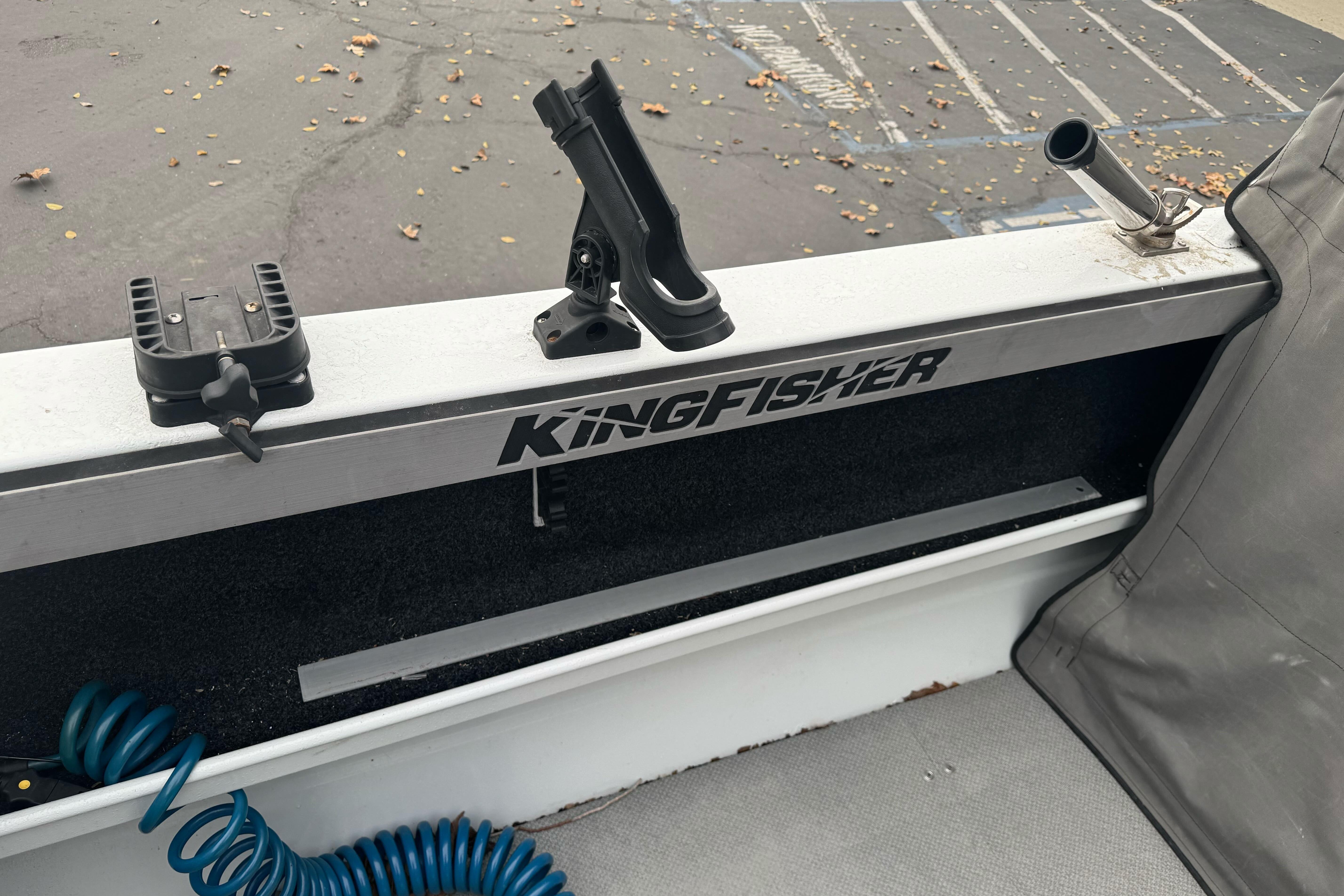 KingFisher 2025 Escape HHT boat interior with rod holders and logo, 2021 model.