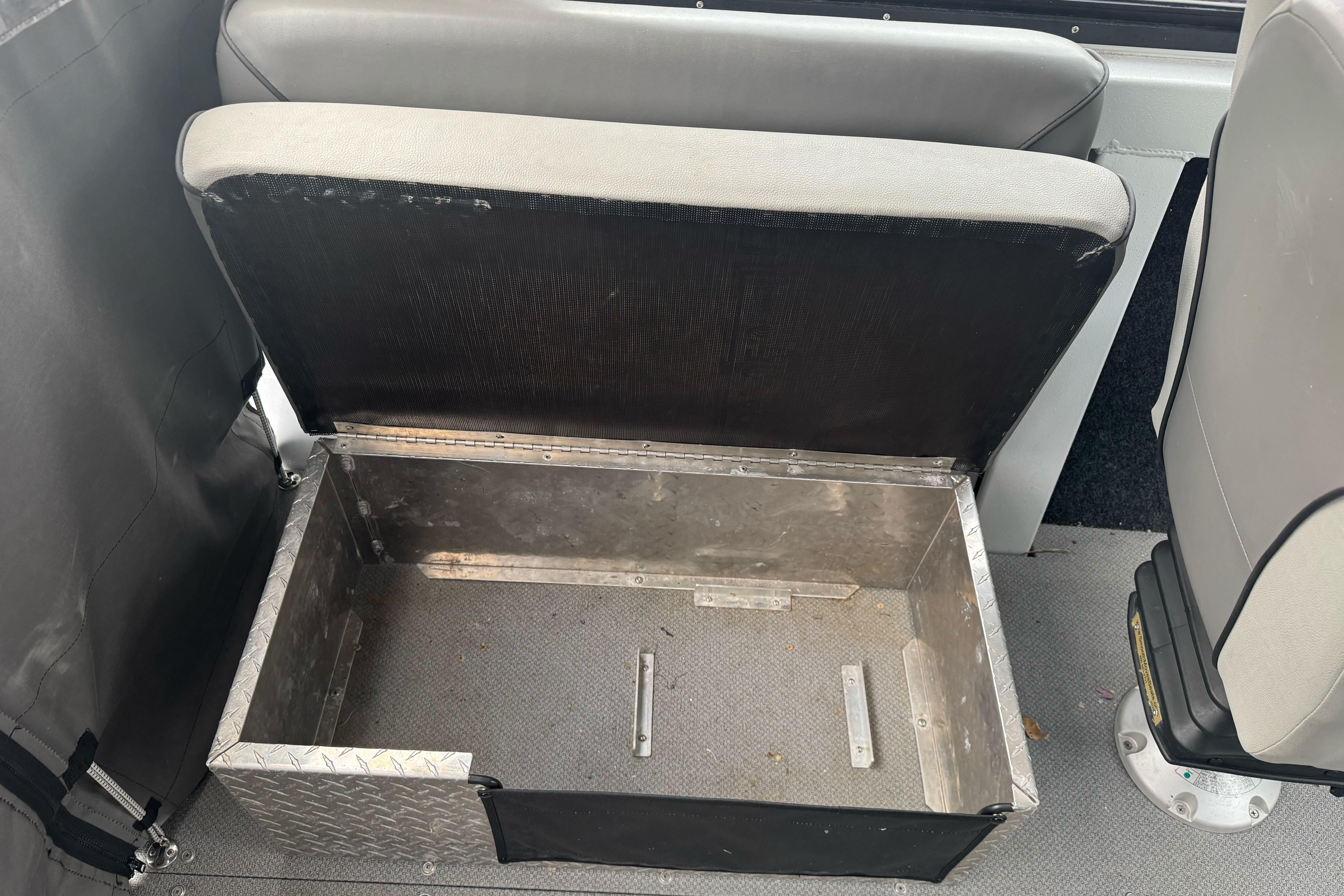 Open storage compartment in 2021 KingFisher 2025 Escape HHT boat interior.