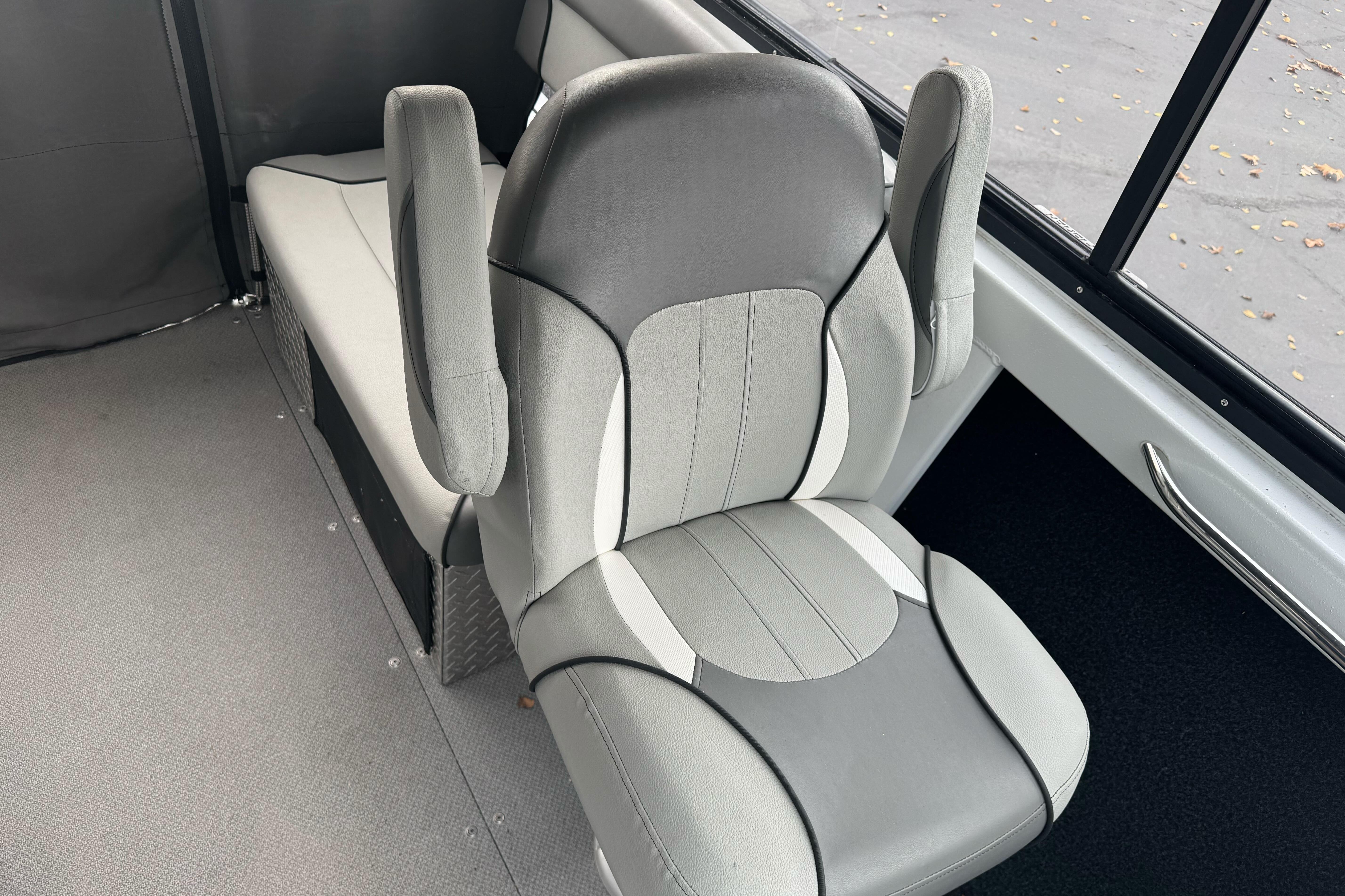 Gray and white boat seat in KingFisher 2025 Escape HHT, 2021 model.