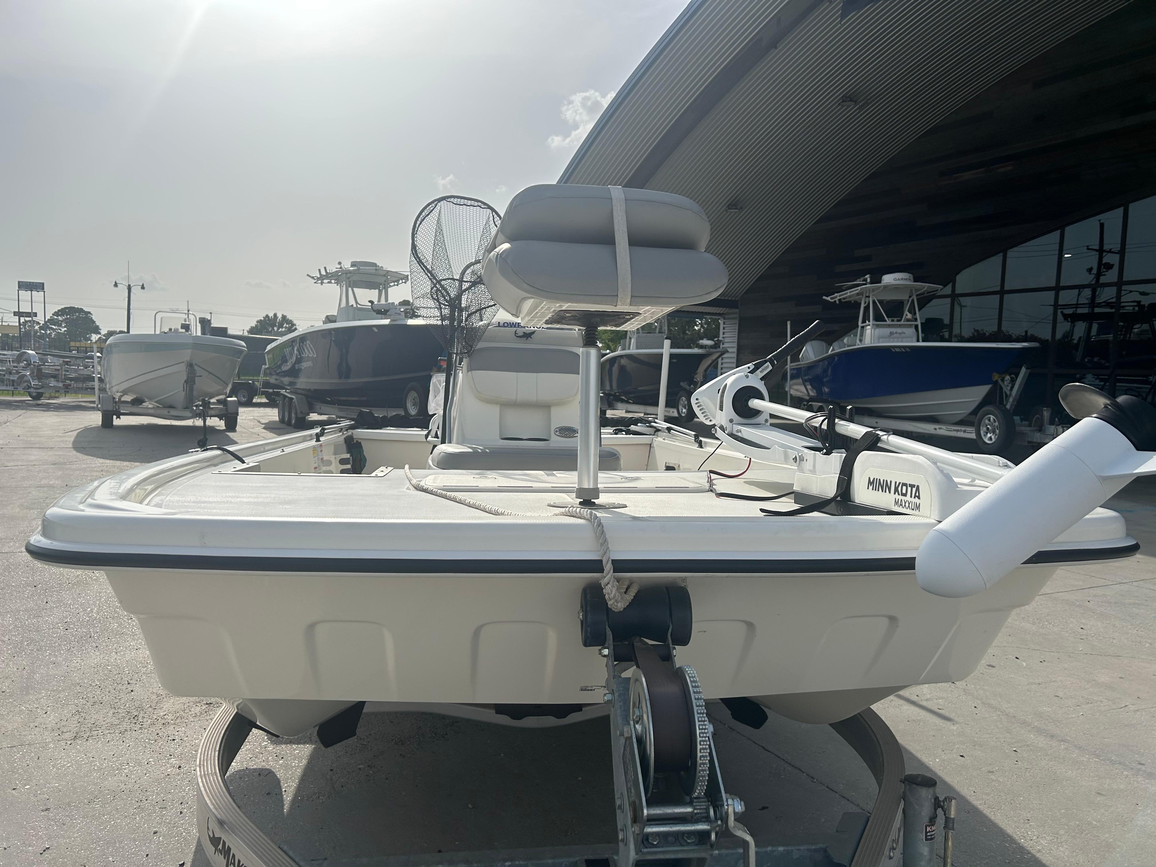 2021 Mako Pro Skiff 19 CC boat on trailer, equipped with Minn Kota trolling motor.