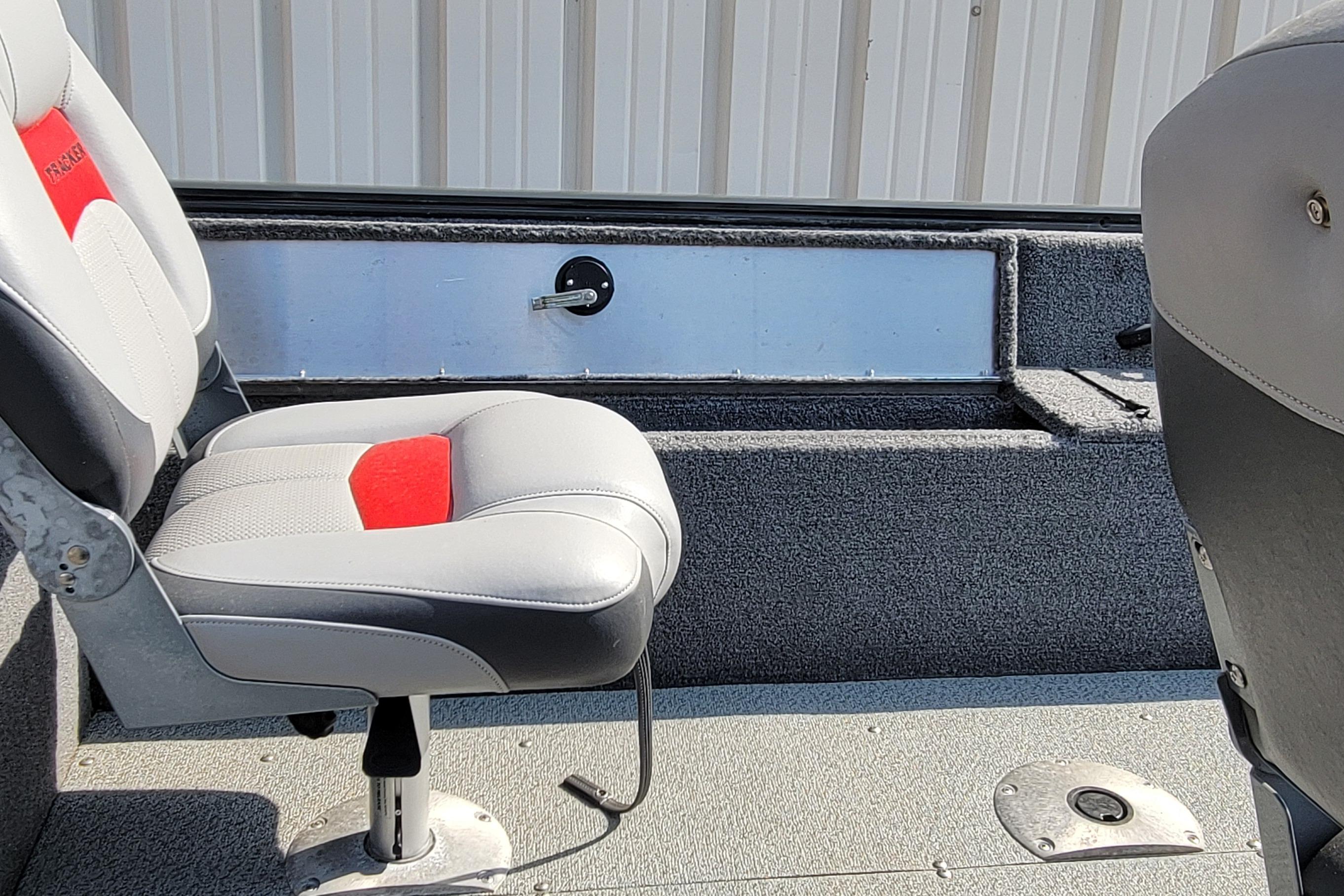 2016 TRACKER MARINE PRO GUIDE V-16 SC boat interior with gray and red seating.