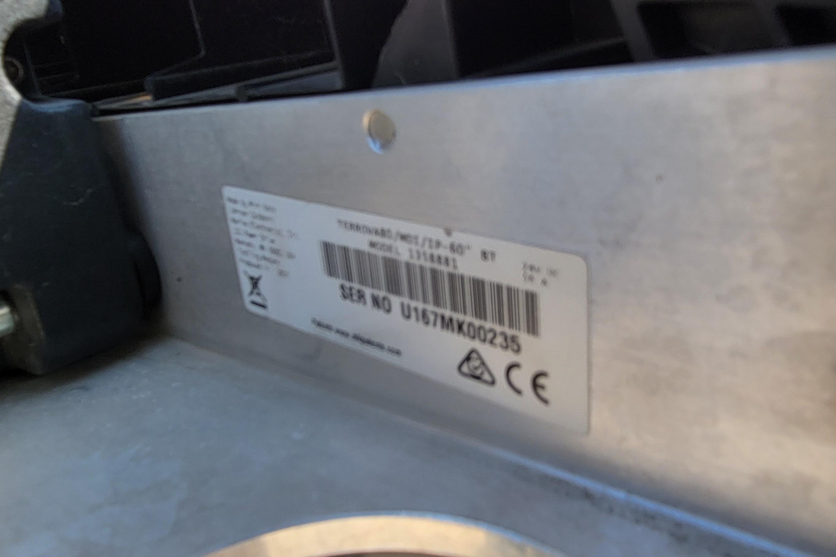 Label on a 2016 Tracker device with serial number and certification symbols.