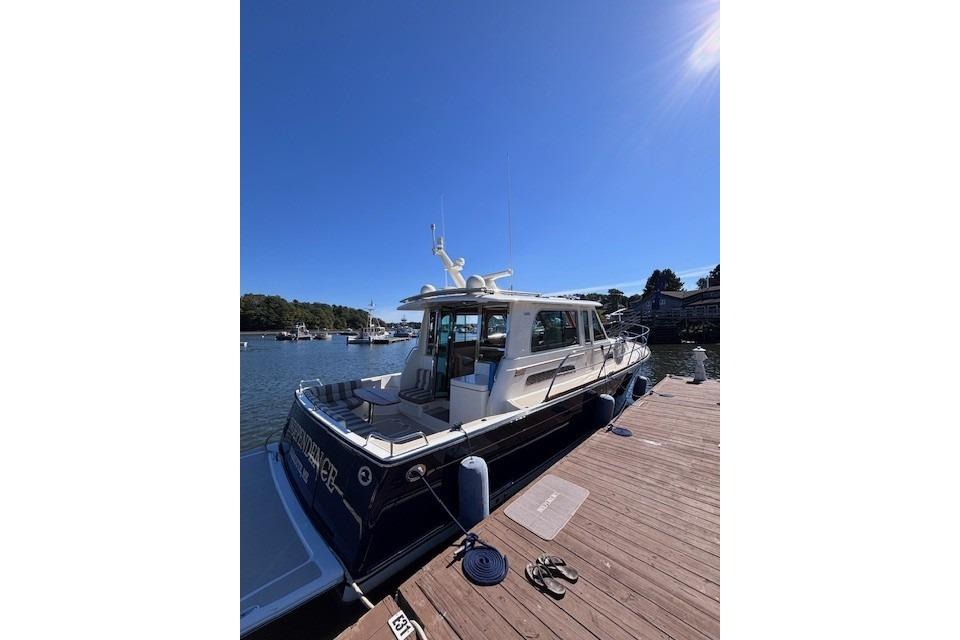 2012 Sabre 42 Salon Express yacht docked on a sunny day.