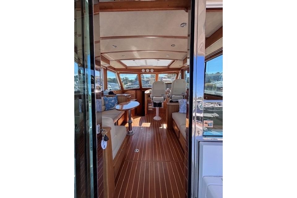 Interior of 2012 Sabre 42 Salon Express yacht with elegant wood finish and seating.