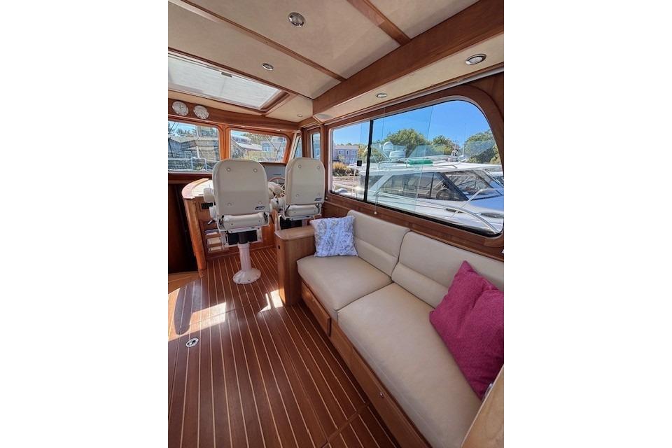 Interior of 2012 Sabre 42 Salon Express yacht with plush seating and helm chairs.