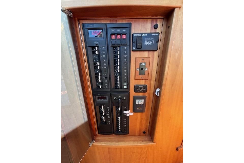 Electrical panel on 2012 Sabre 42 Salon Express yacht, featuring switches and controls.