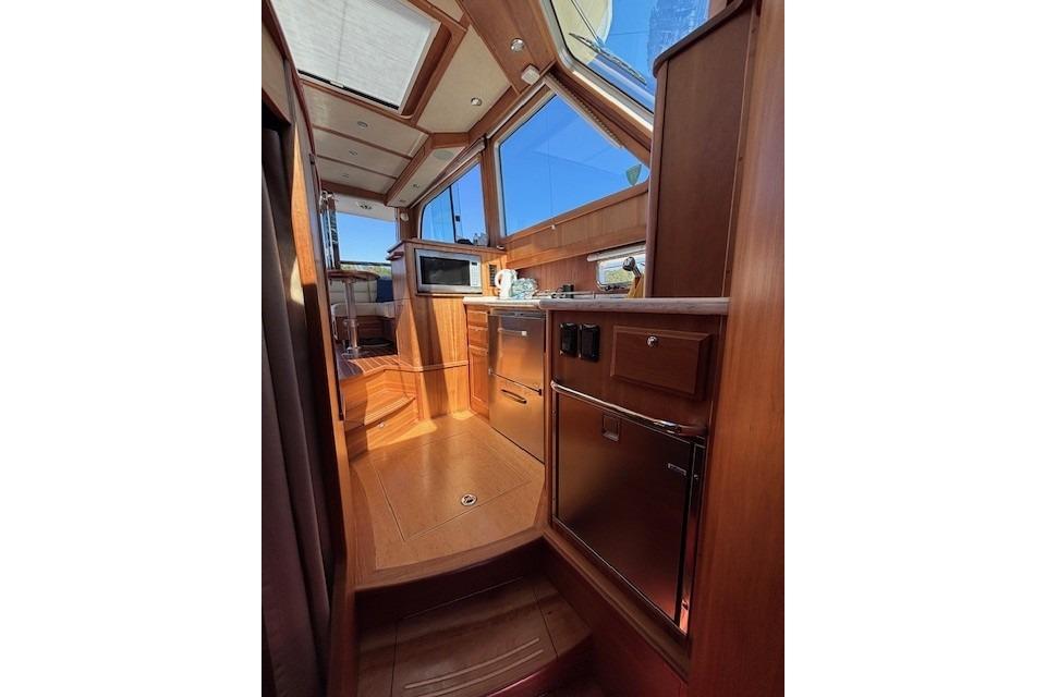 Interior of 2012 Sabre 42 Salon Express yacht with wood finish and modern amenities.