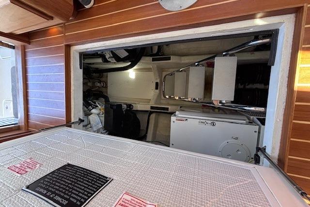 Engine room of 2012 Sabre 42 Salon Express yacht, showcasing mechanical components.