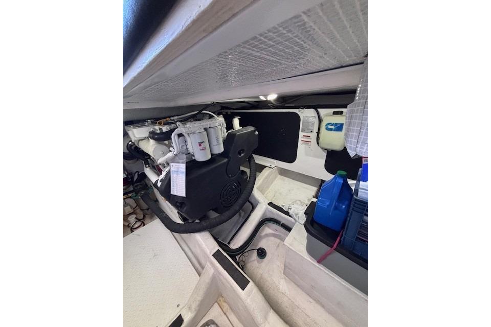 Engine room of 2012 Sabre 42 Salon Express with visible components and storage.