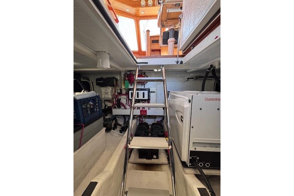 Engine room of 2012 Sabre 42 Salon Express with visible equipment and ladder.