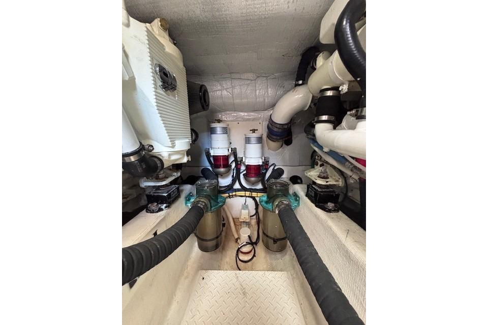 Engine room of 2012 Sabre 42 Salon Express with visible pipes and machinery.