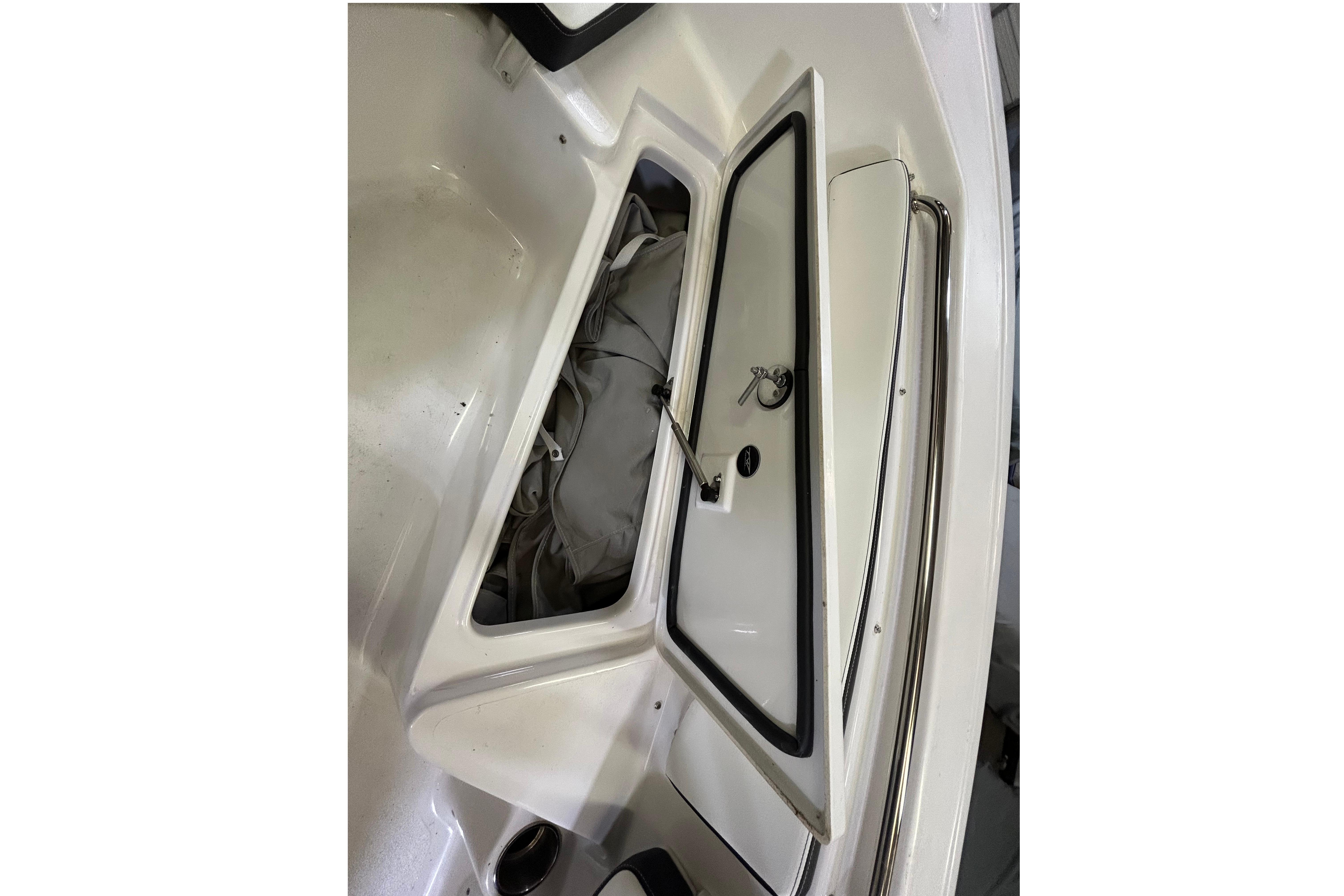 Open storage compartment on 2024 Tidewater 198 CC Adventure boat.