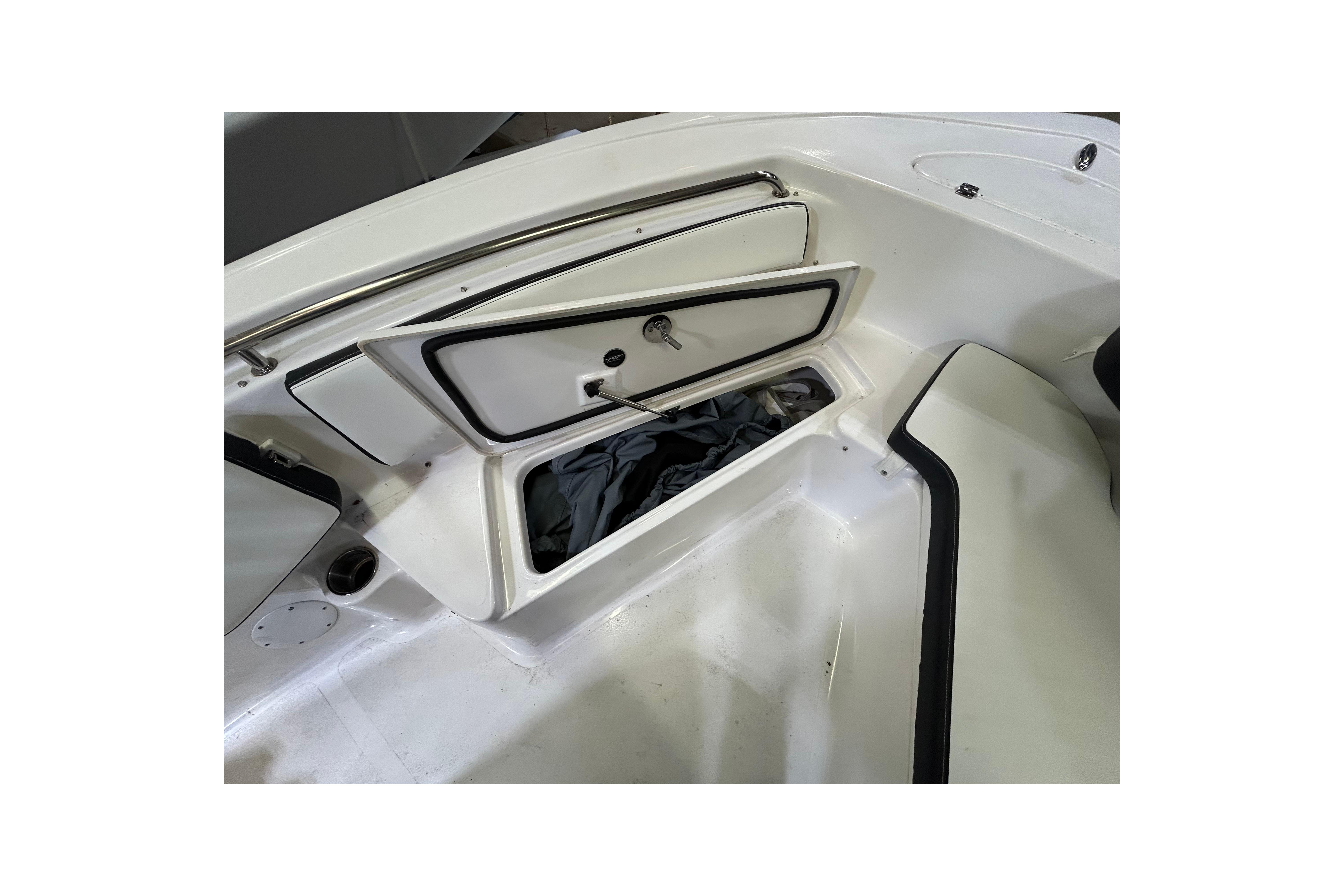 2024 Tidewater 198 CC Adventure boat storage compartment open, showcasing interior space.
