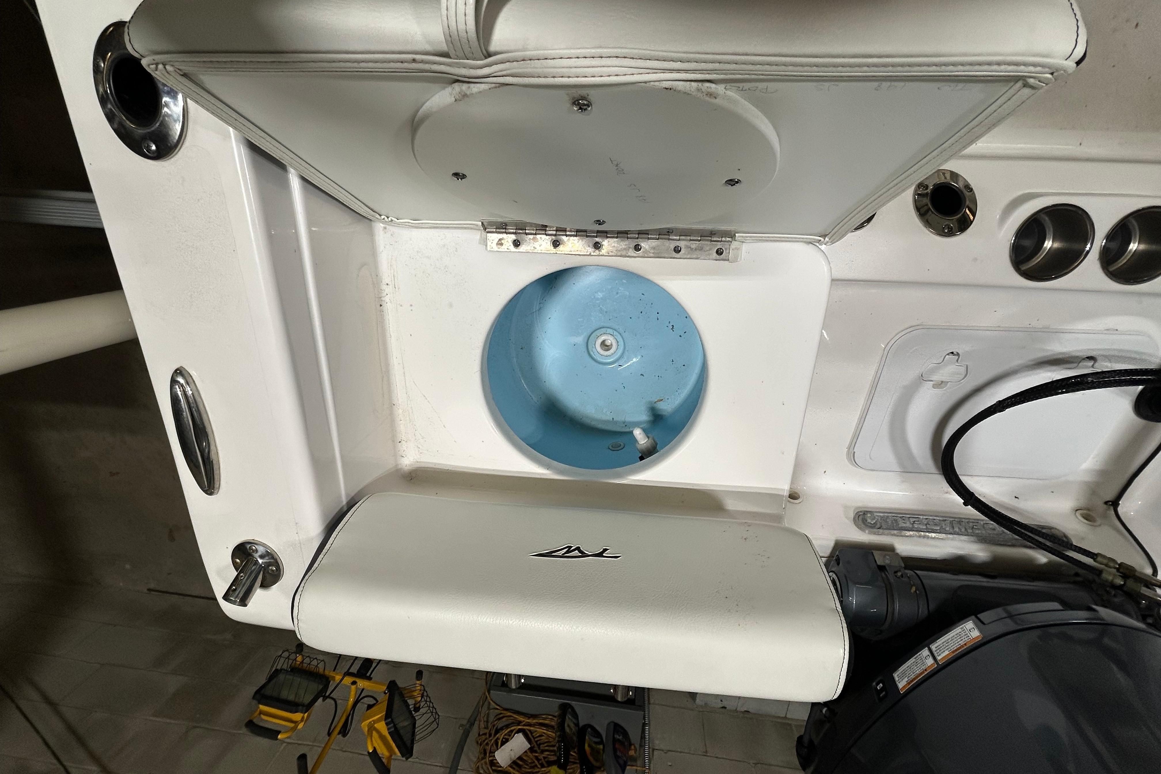 2024 Tidewater 198 CC Adventure boat interior with storage compartment and seating.