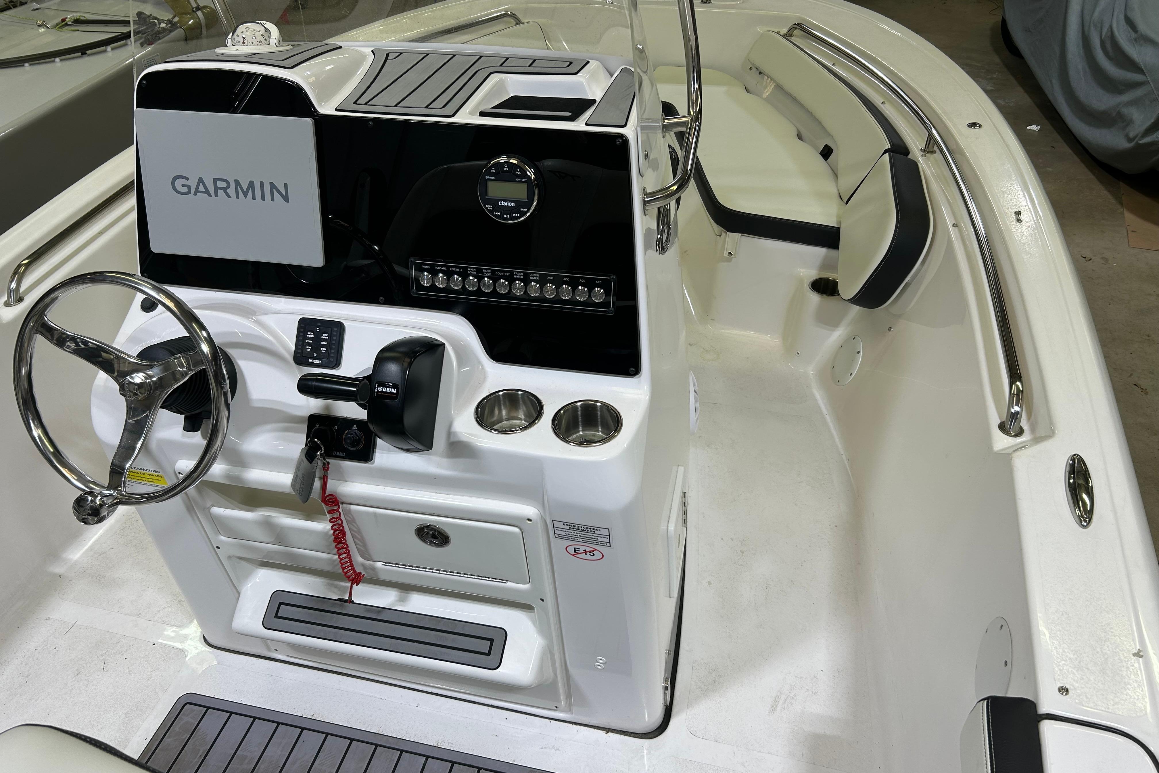 2024 Tidewater 198 CC Adventure boat interior with Garmin navigation system and seating.