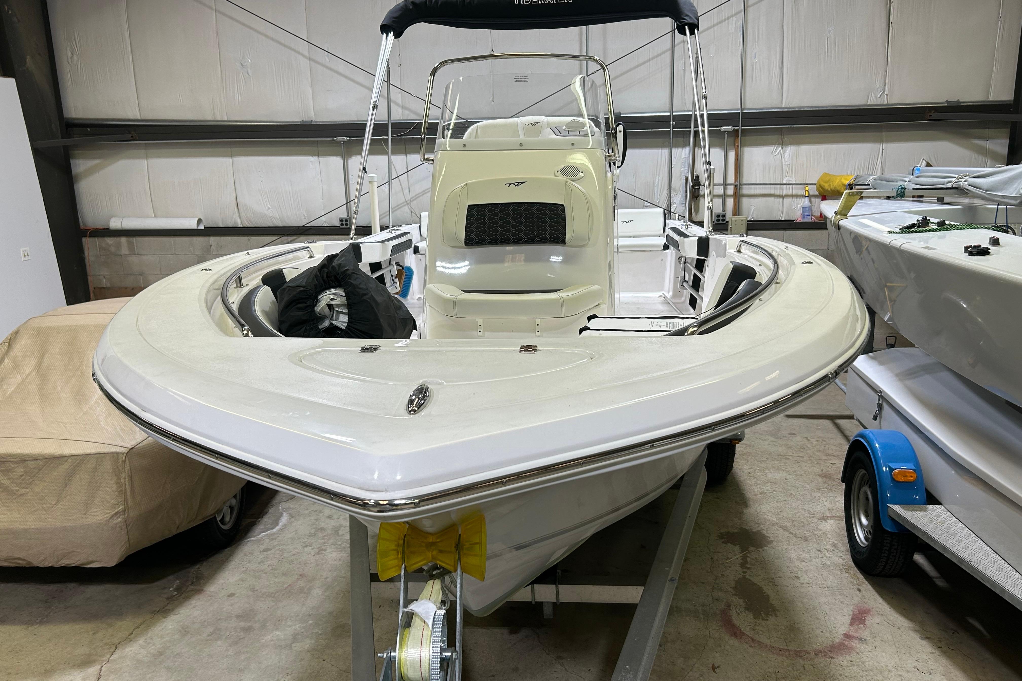 2024 Tidewater 198 CC Adventure boat in storage, front view.