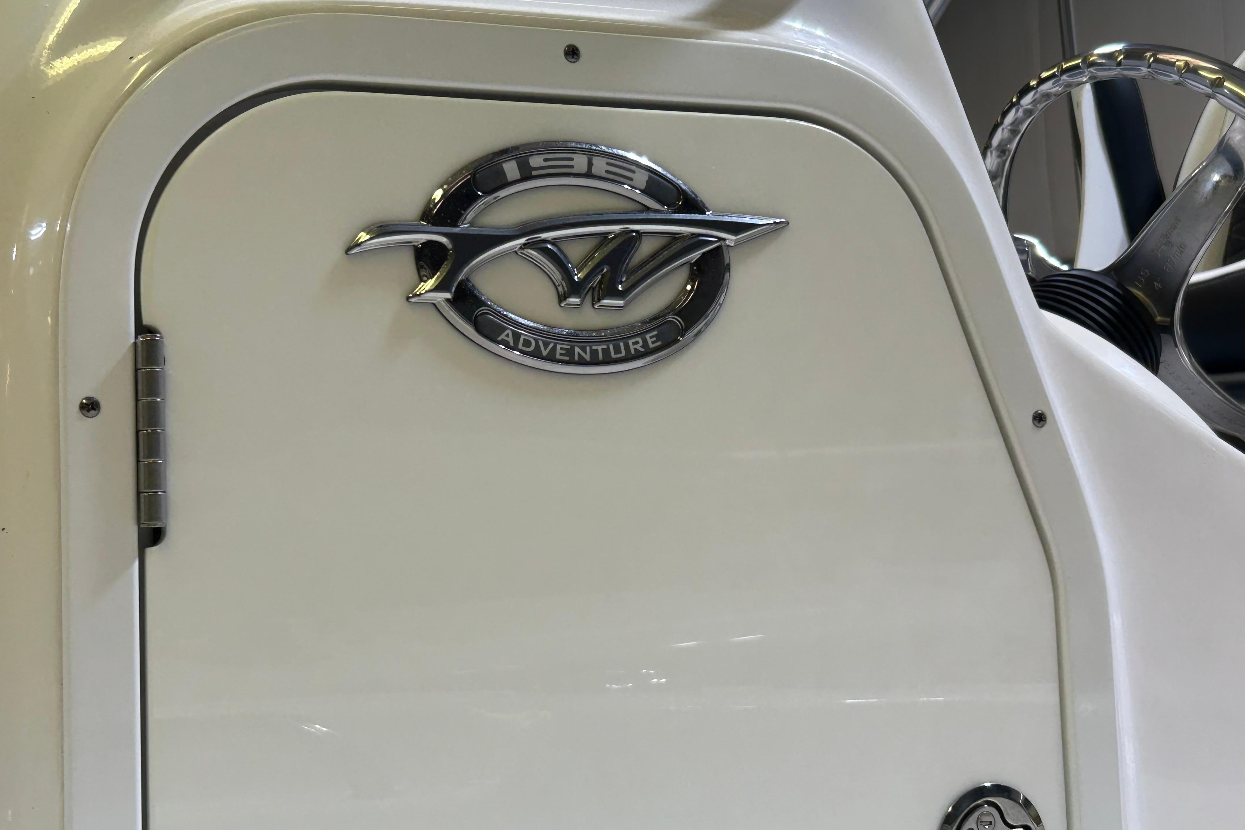 2024 Tidewater 198 CC Adventure boat emblem and steering wheel detail.
