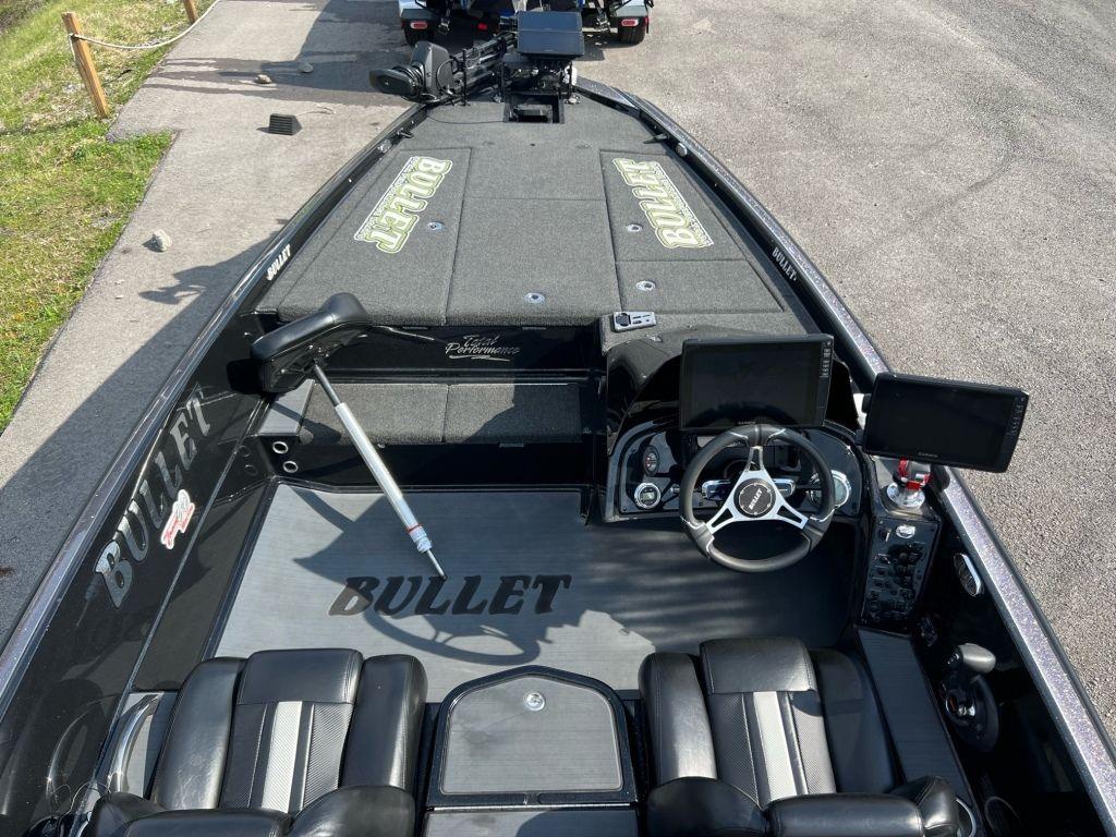 2022 Bullet 21XRS boat interior with steering wheel and seating.
