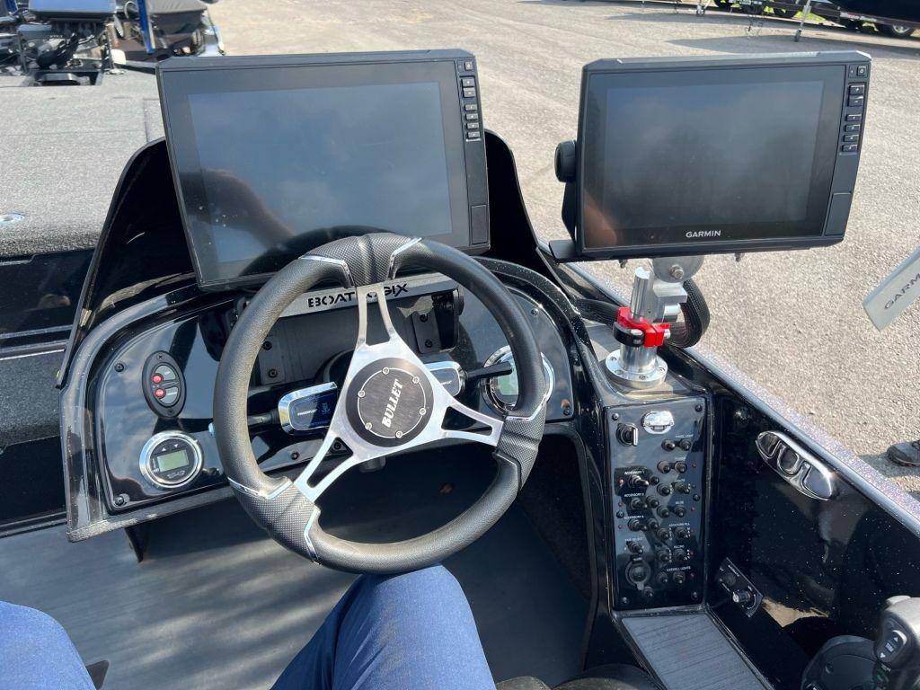 2022 Bullet 21XRS boat dashboard with dual Garmin displays and steering wheel.