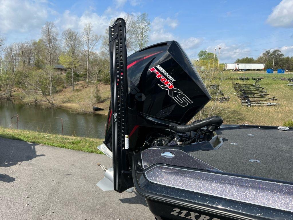 2022 Bullet 21XRS boat with Mercury Pro XS engine by a scenic lake.