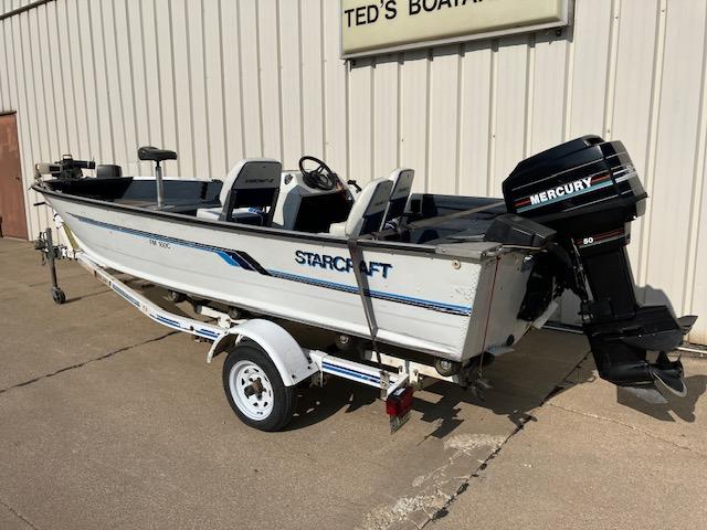 1992 Starcraft FM 160C boat with Mercury outboard motor on trailer.